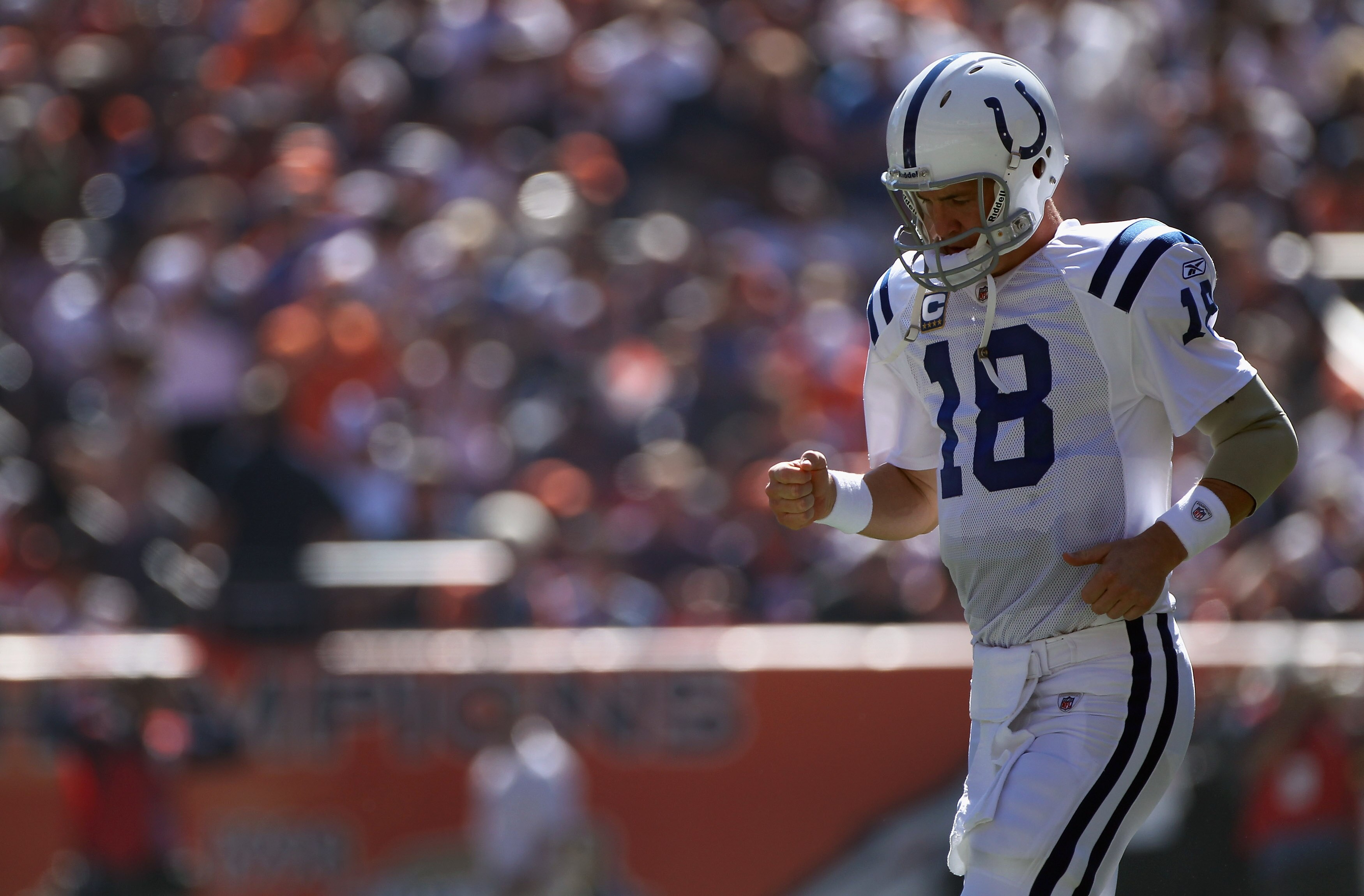 DENVER - SEPTEMBER 26:  Quarterback Peyton Manning #18 of the Indianapolis Colts directs the offense against the Denver Broncos at INVESCO Field at Mile High on September 26, 2010 in Denver, Colorado. The Colts defeated the Broncos 27-13.  (Photo by Doug 