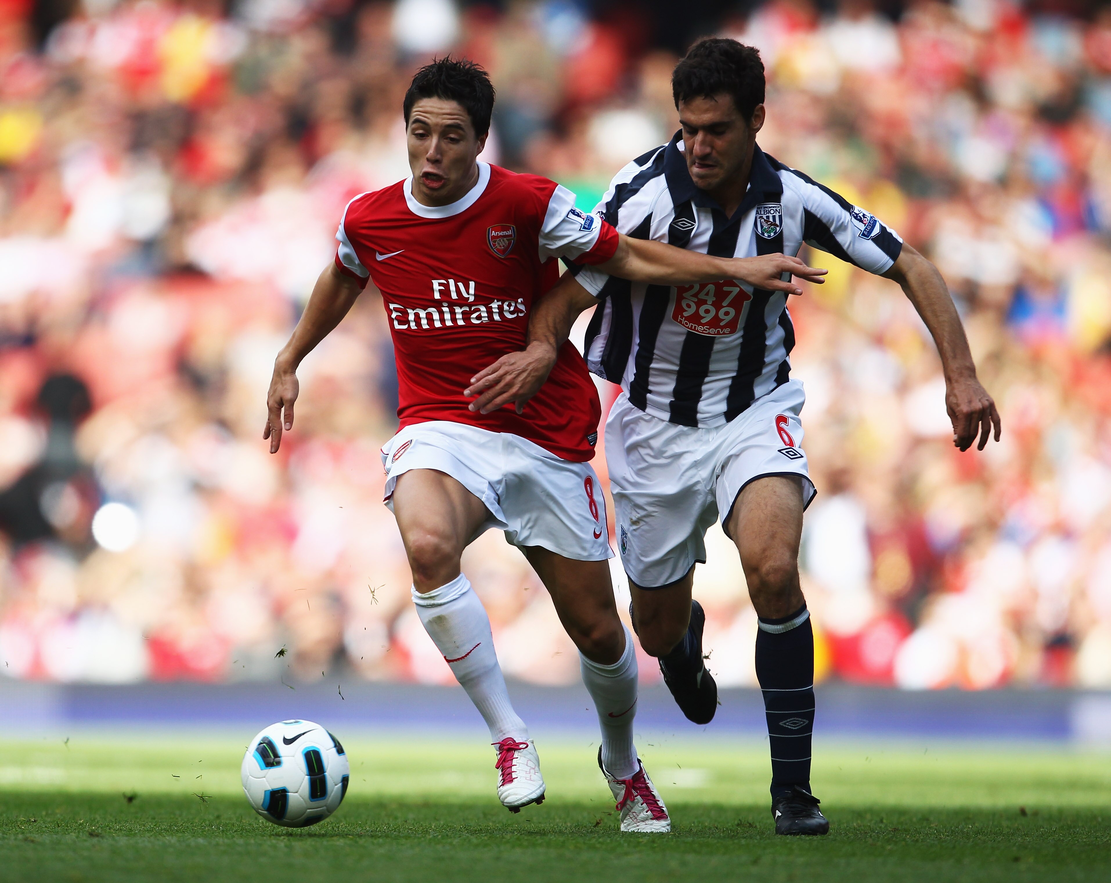 LONDON, ENGLAND - SEPTEMBER 25:  Samir Nasri of Arsenal takes on Pablo Ibanez of West Bromwich Albion during the Barclays Premier League match between Arsenal and West Bromwich Albion at the Emirates Stadium on September 25, 2010 in London, England.  (Pho