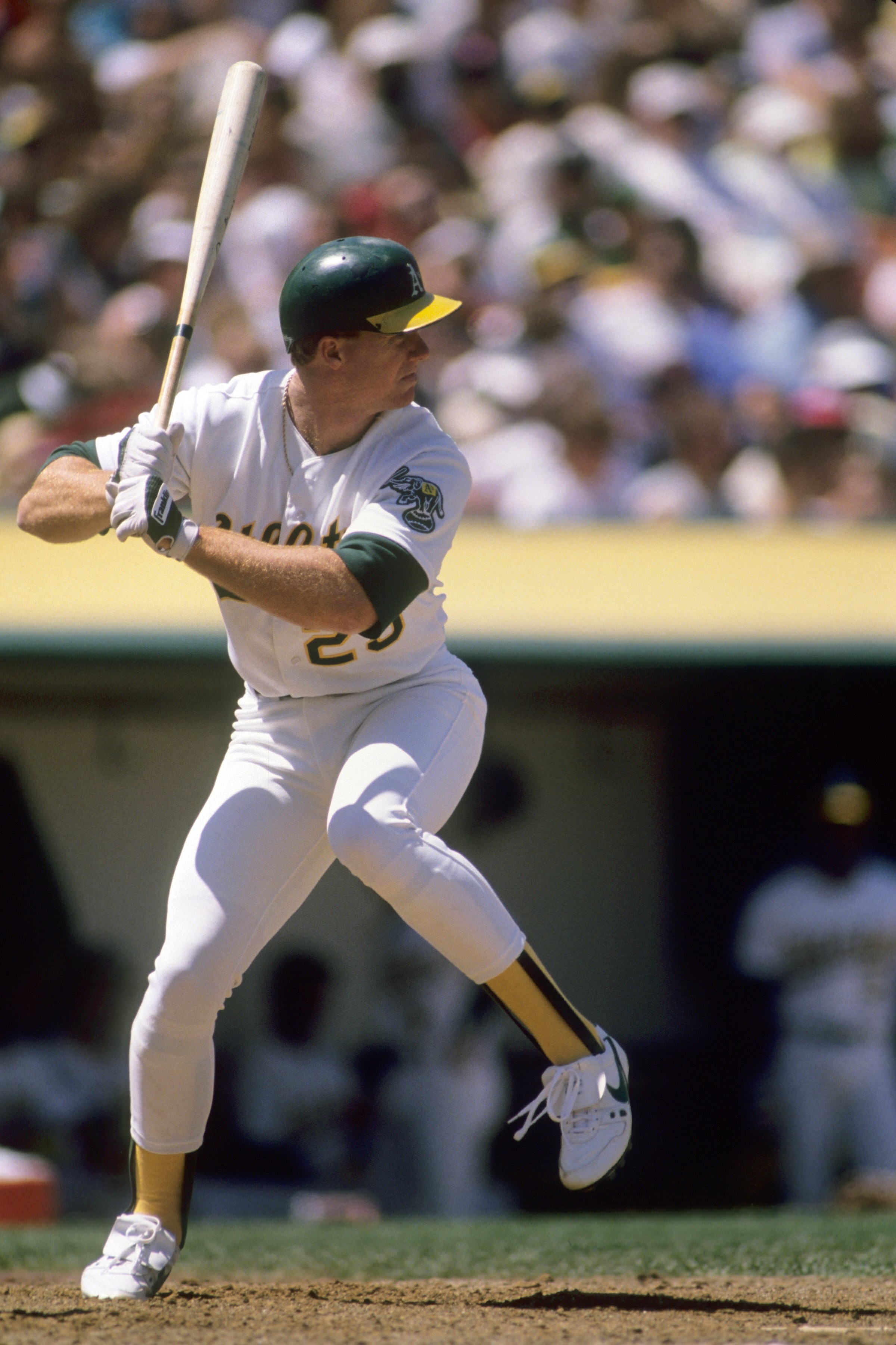 OAKLAND, CA - 1989:  Mark McGwire #25 of the Oakland Athletics leads off during a game in the 1989 season at Oakland-Alameda County Coliseum in Oakland, California. (Photo by Getty Images)