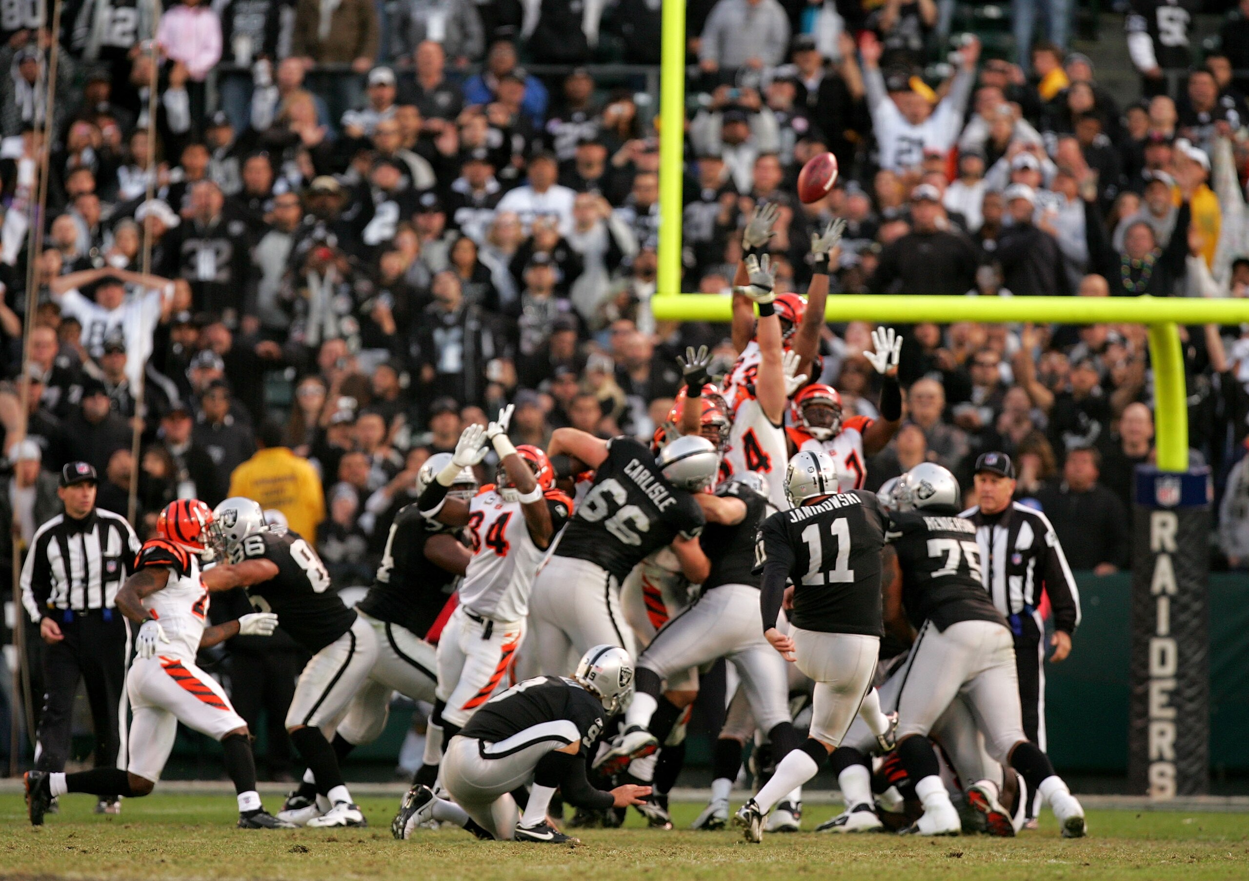 OAKLAND, CA - NOVEMBER 22:  Sebastian Janikowski #11 of the Oakland Raiders kicks the winning field goal with less than a minute to play against the Cincinnati Bengals at Oakland-Alameda County Coliseum on November 22, 2009 in Oakland, California.  (Photo