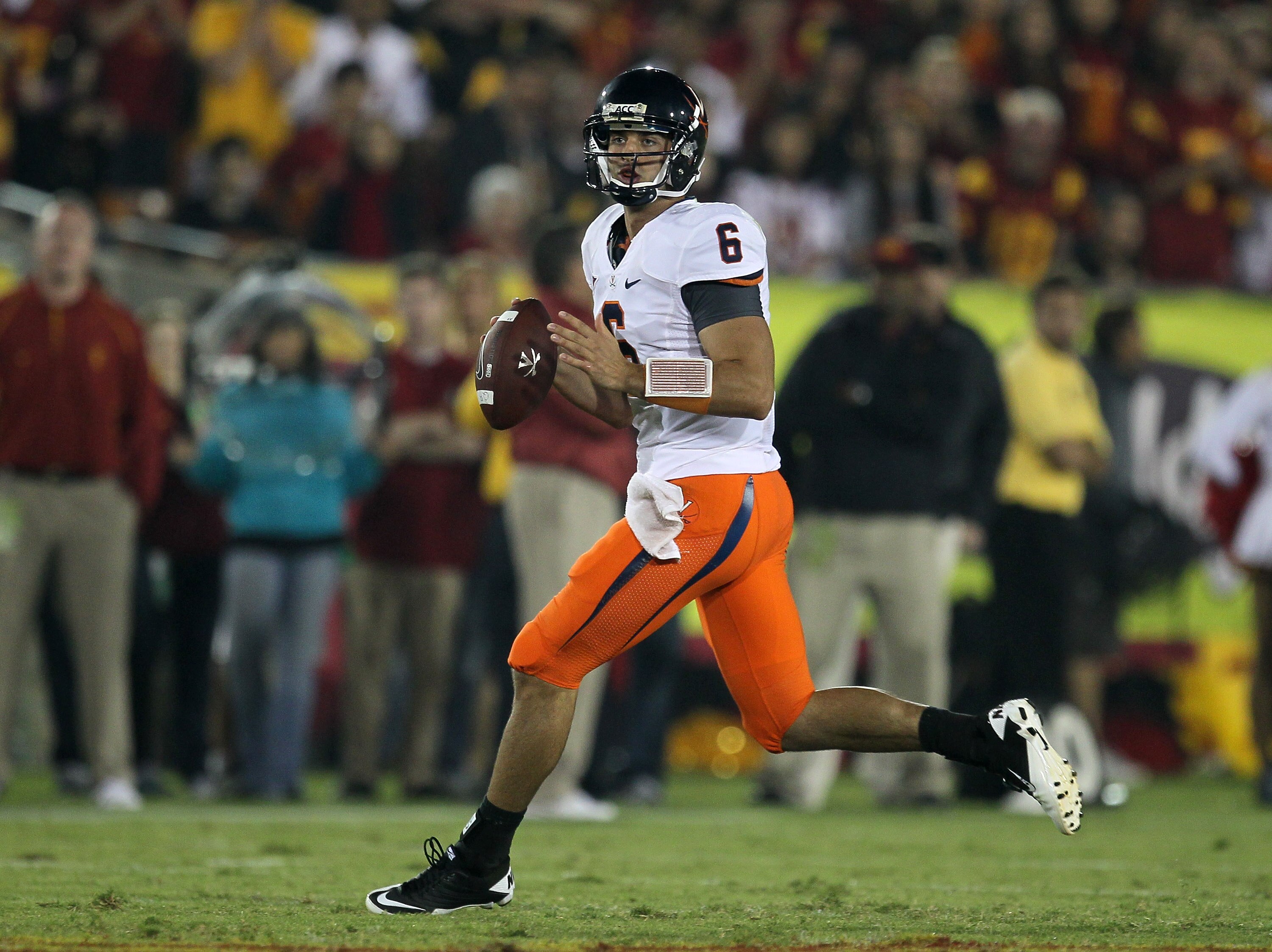 LOS ANGELES, CA - SEPTEMBER 11:  Quarterback Marc Verica #6 of the Virginia Cavaliers drops back to pass against the USC Trojans at Los Angeles Memorial Coliseum on September 11, 2010 in Los Angeles, California. USC won 17-14.  (Photo by Stephen Dunn/Gett