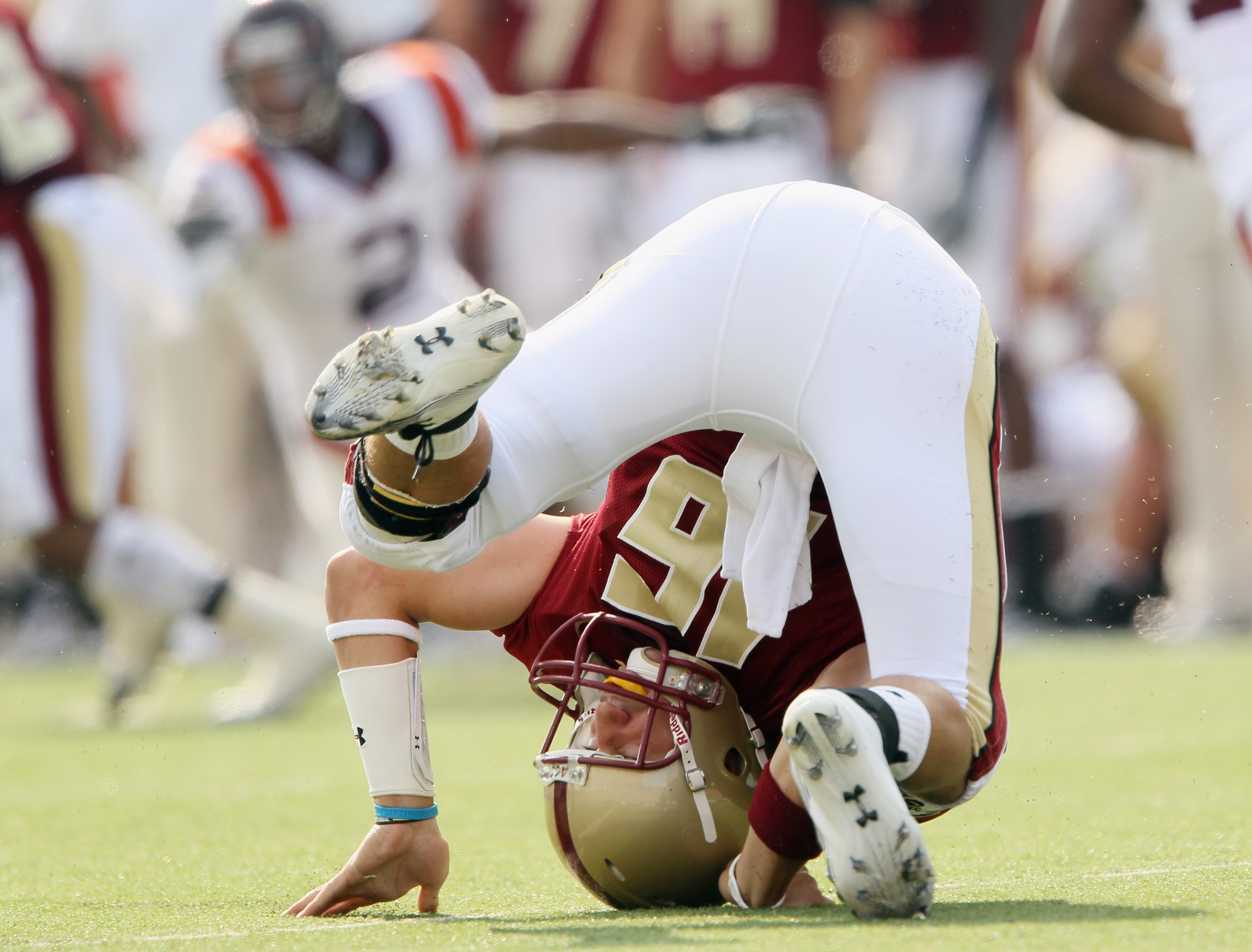 CHESTNUT HILL, MA - SEPTEMBER 25:  Mike Marscovetra #16 of the Boston College Eagles topples over after he is pressured in the fourth quarter against the Virginia Tech Hokies on September 25, 2010 at Alumni Stadium in Chestnut Hill, Massachusetts. Virgini