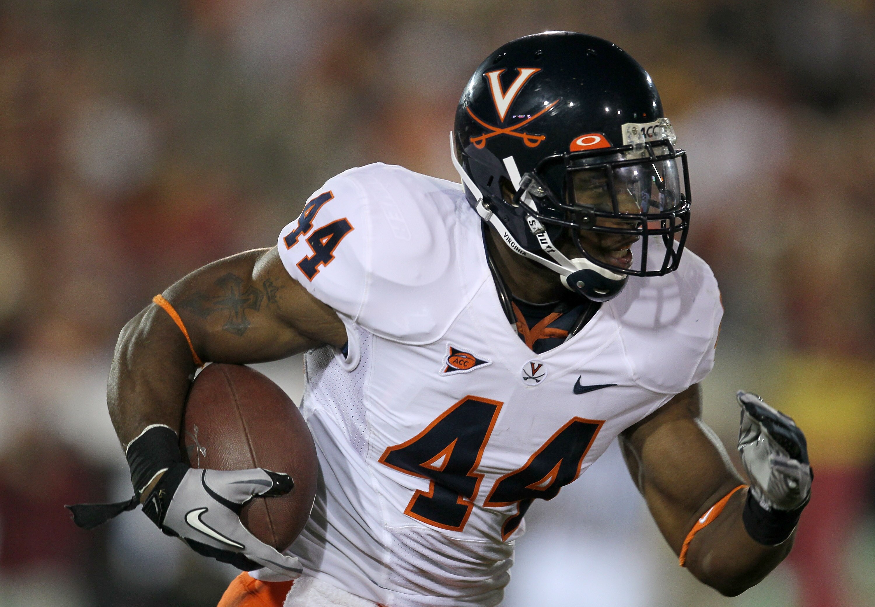 LOS ANGELES - SEPTEMBER 11:  Running back Raynard Horne #44 of the Virginia Cavaliers carries the ball against the USC Trojans at Los Angeles Memorial Coliseum on September 11, 2010 in Los Angeles, California. (Photo by Stephen Dunn/Getty Images)