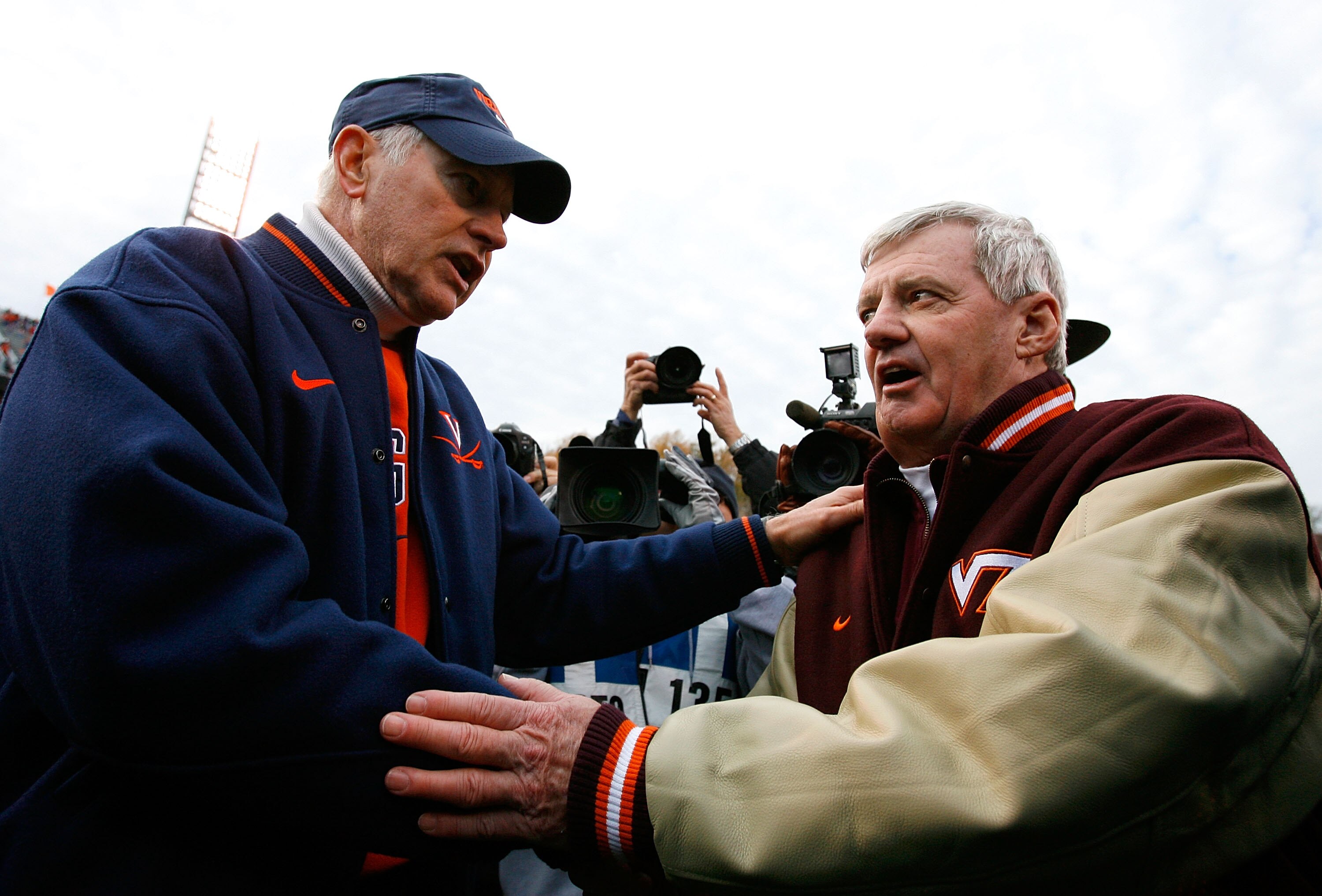 CHARLOTTESVILLE, VA - NOVEMBER 24:  Head coach Al Groh (L) of the Virginia Cavaliers congratulates head coach Frank Beamer of the Virginia Tech Hokies after after the Hokies 33-21 win at Scott Stadium on November 24, 2007 in Charlottesville, Virginia.  (P