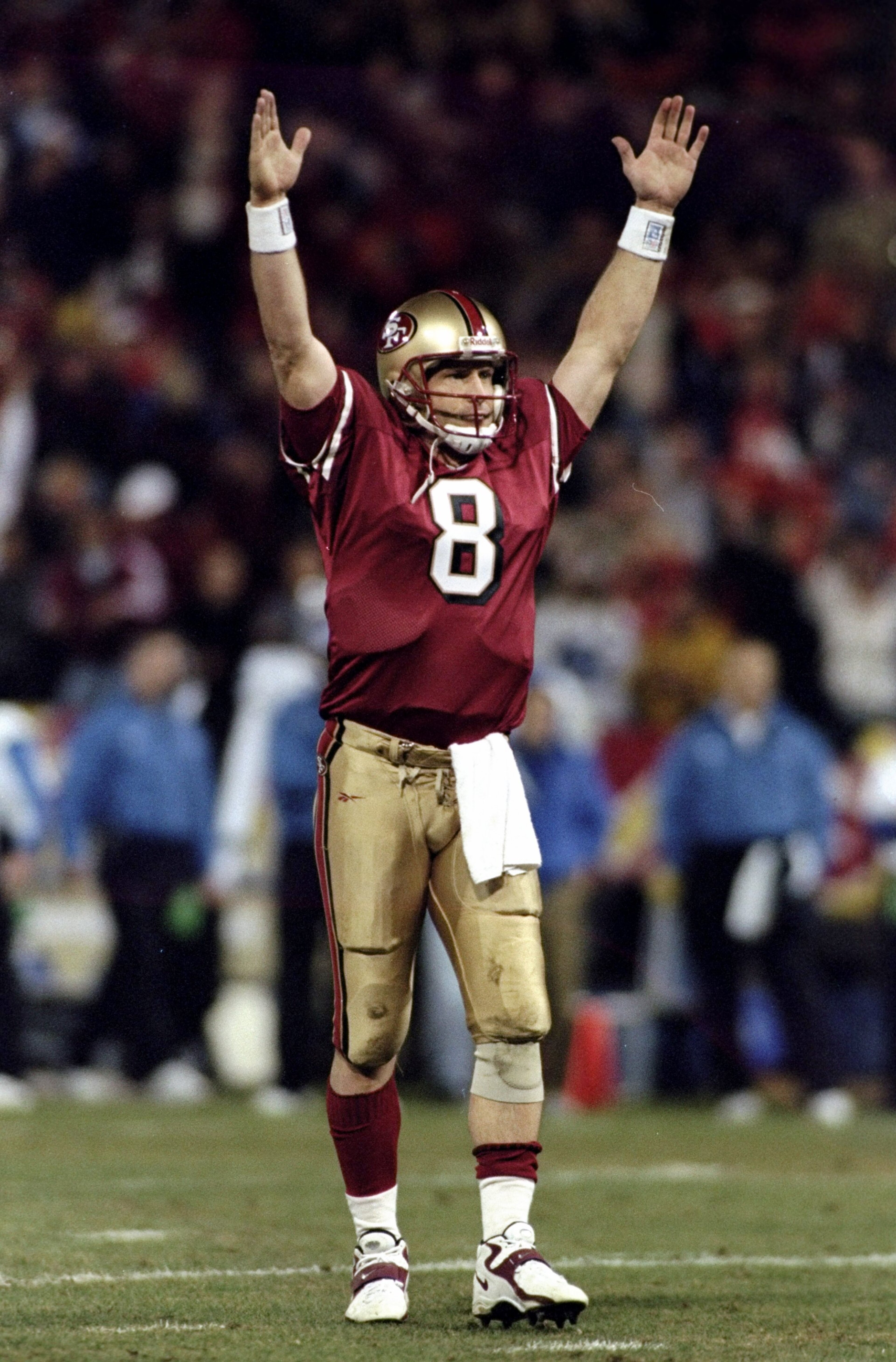 14 Dec 1998: Quarterback Steve Young #8 of the San Francisco 49ers celebrates during a game against the Detroit Lions at 3Com Park in San Francisco, California. The 49ers defeated the Lions 35-13. 14 Dec 1998: Quarterback Steve Young #8 of the San Francisco 49ers celebrates during a game against the Detroit Lions at 3Com Park in San Francisco, California. The 49ers defeated the Lions 35-13.