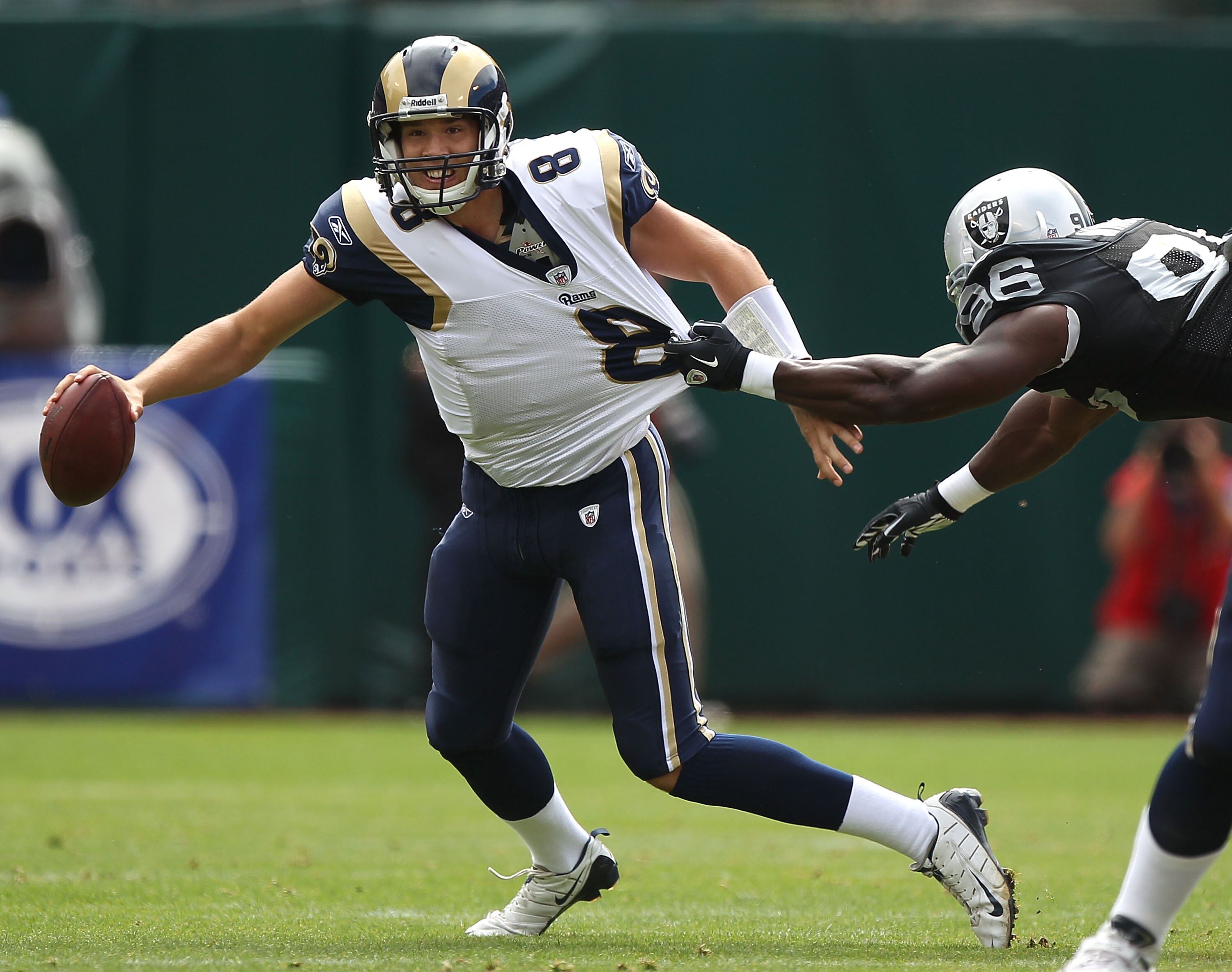 OAKLAND, CA - SEPTEMBER 19:  Sam Bradford #8 of the St. Louis Rams is saked by Kamerion Wimbley #96 of the Oakland Raiders during an NFL game at Oakland-Alameda County Coliseum on September 19, 2010 in Oakland, California.  (Photo by Jed Jacobsohn/Getty I