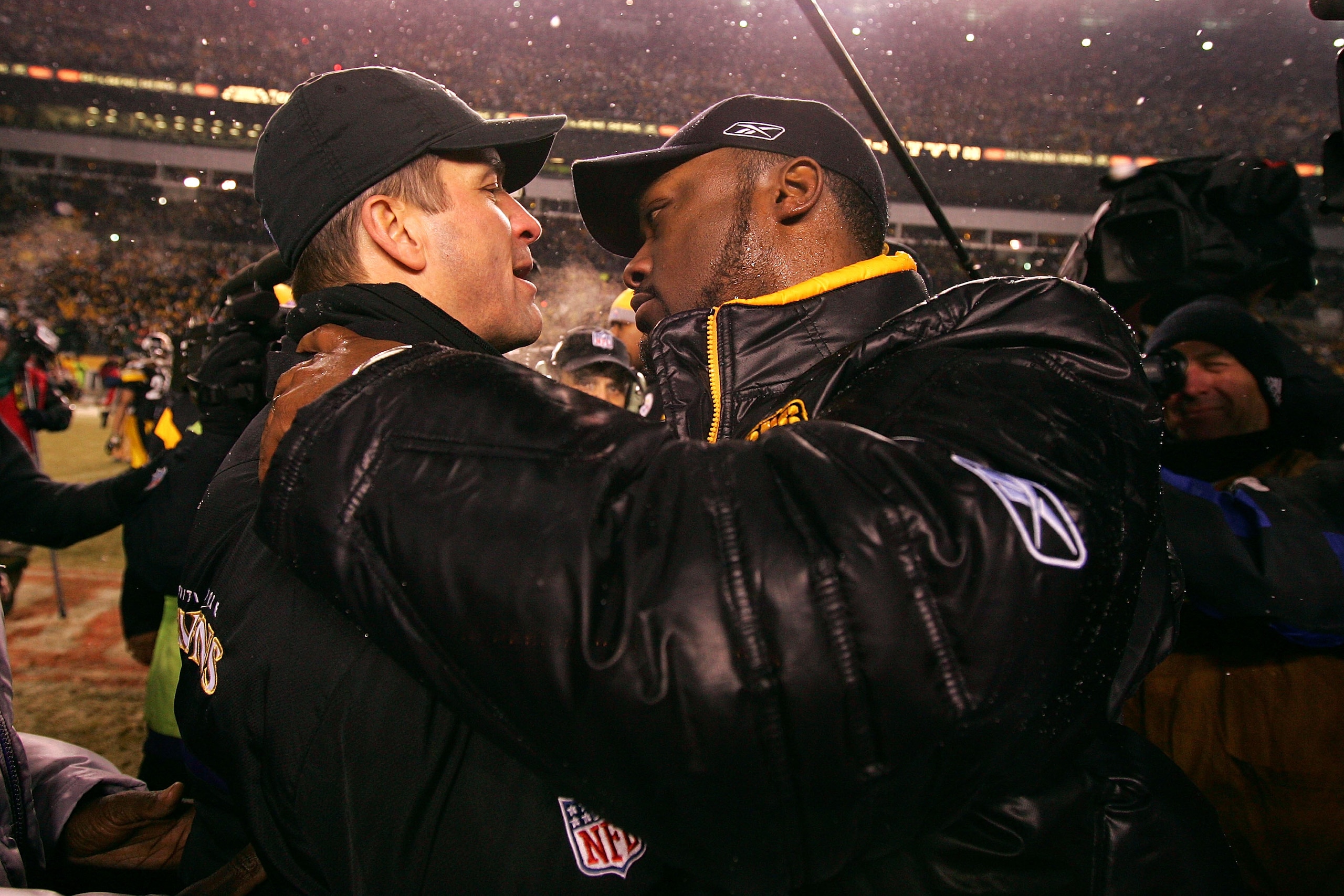PITTSBURGH - JANUARY 18:  Head coach Mike Tomlin #(R) of the Pittsburgh Steelers is congratulated by head coach John Harbaugh of the Baltimore Ravens after the Steelers won 23-14 during the AFC Championship game on January 18, 2009 at Heinz Field in Pitts