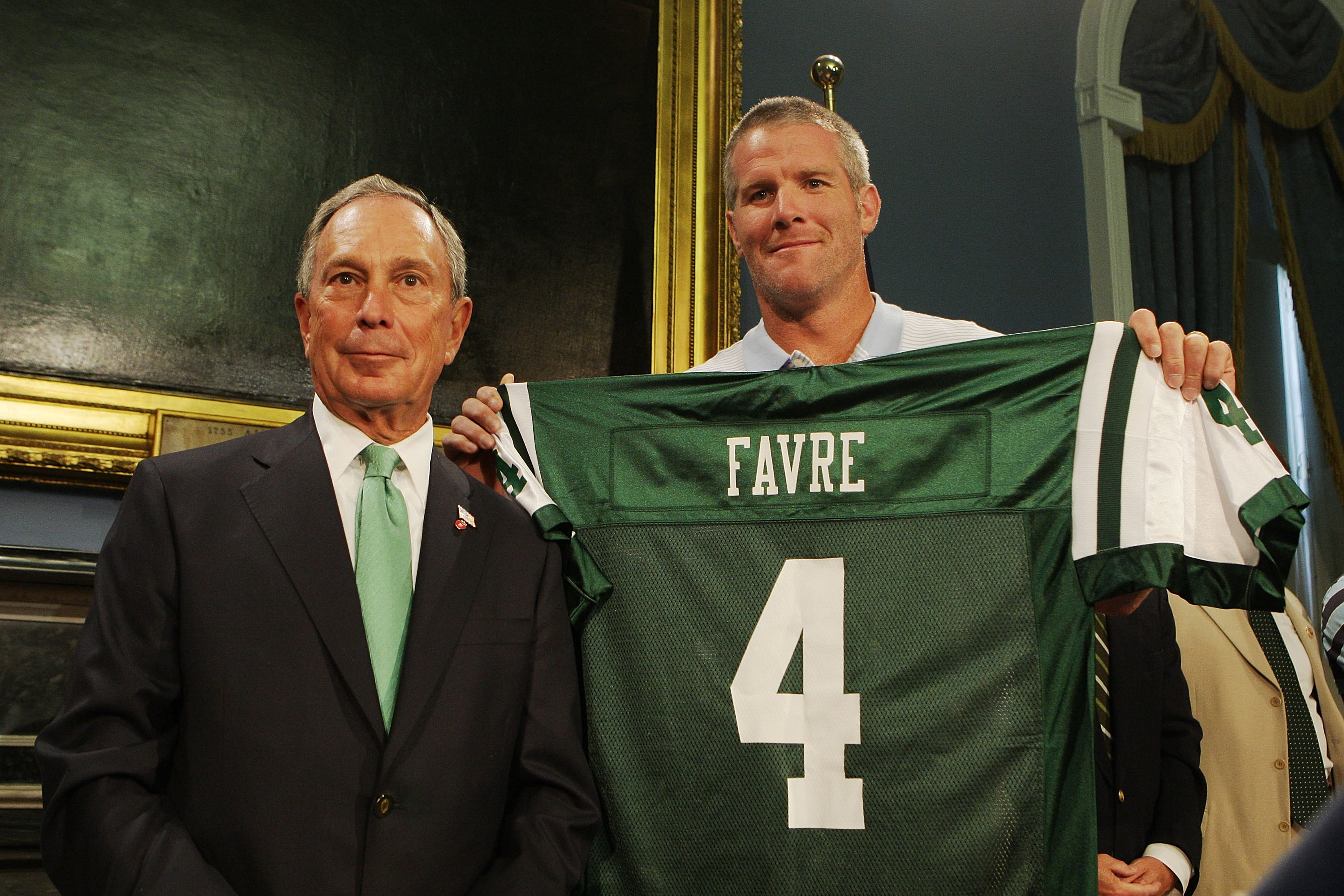 NEW YORK - AUGUST 08: New York City Mayor Michael Bloomberg and Brett Favre pose for a photo during a press conference to Welcome Brett Favre to New York at City Hall on August 8, 2008 in New York City. Favre was traded to the New York Jets from the Green