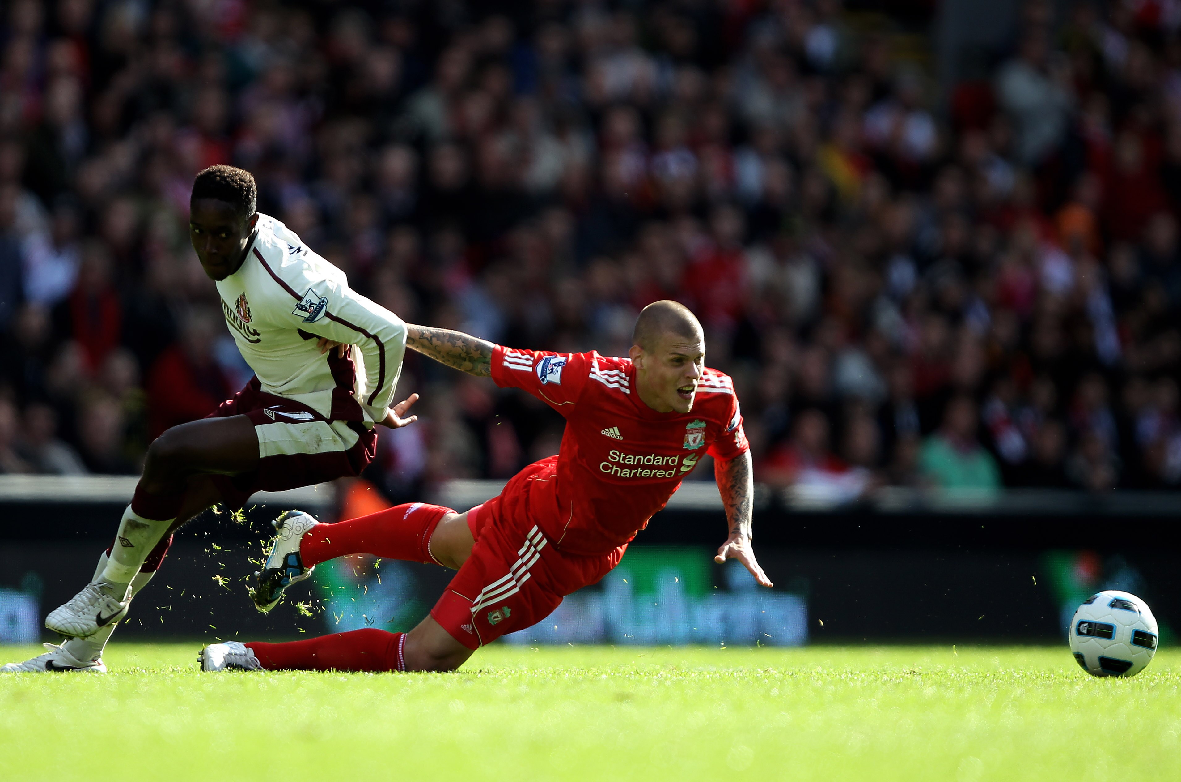 LIVERPOOL, ENGLAND - SEPTEMBER 25:  Martin Skrtel of Liverpool in action with Danny Welbeck of Sunderland during the Barclays Premier League match between Liverpool and Sunderland at at Anfield on September 25, 2010 in Liverpool, England.  (Photo by Clive