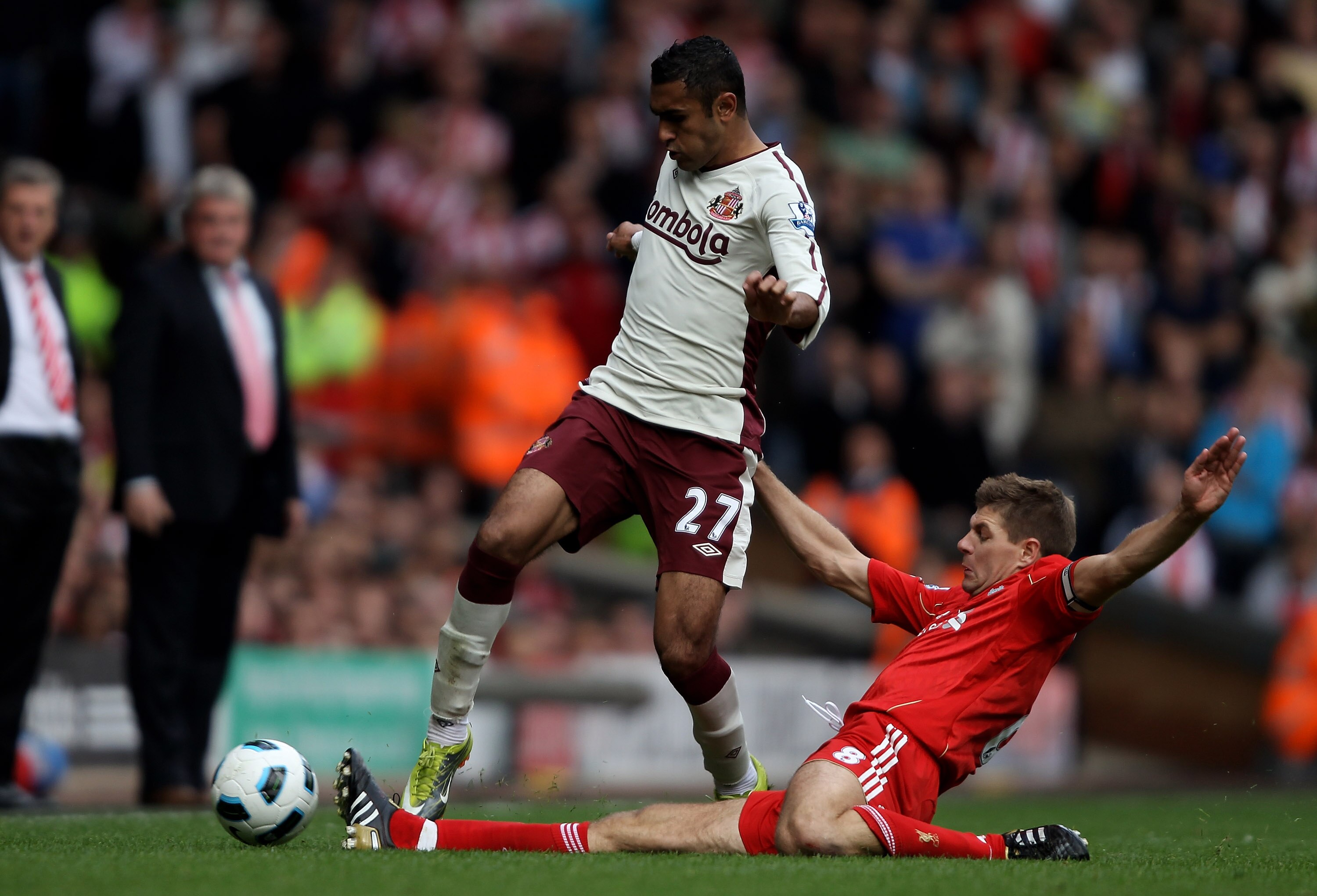 LIVERPOOL, ENGLAND - SEPTEMBER 25:  Steven Gerrard of Liverpool tackles Ahmed Elmohamady of Sunderland during the Barclays Premier League match between Liverpool and Sunderland at at Anfield on September 25, 2010 in Liverpool, England.  (Photo by Clive Br