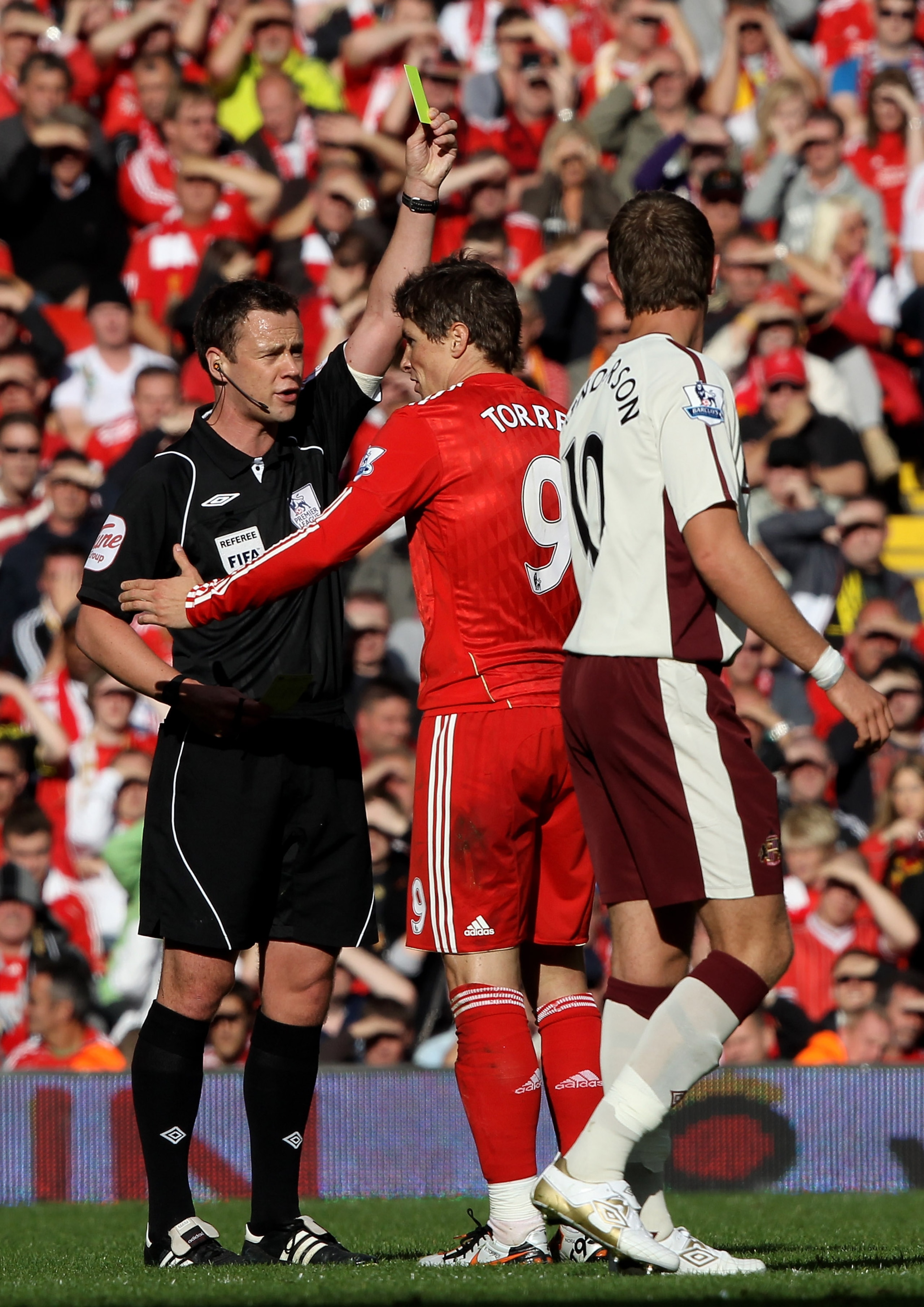 LIVERPOOL, ENGLAND - SEPTEMBER 25:  Fernando Torres of Liverpool is shown the yellow card during the Barclays Premier League match between Liverpool and Sunderland at at Anfield on September 25, 2010 in Liverpool, England.  (Photo by Clive Brunskill/Getty