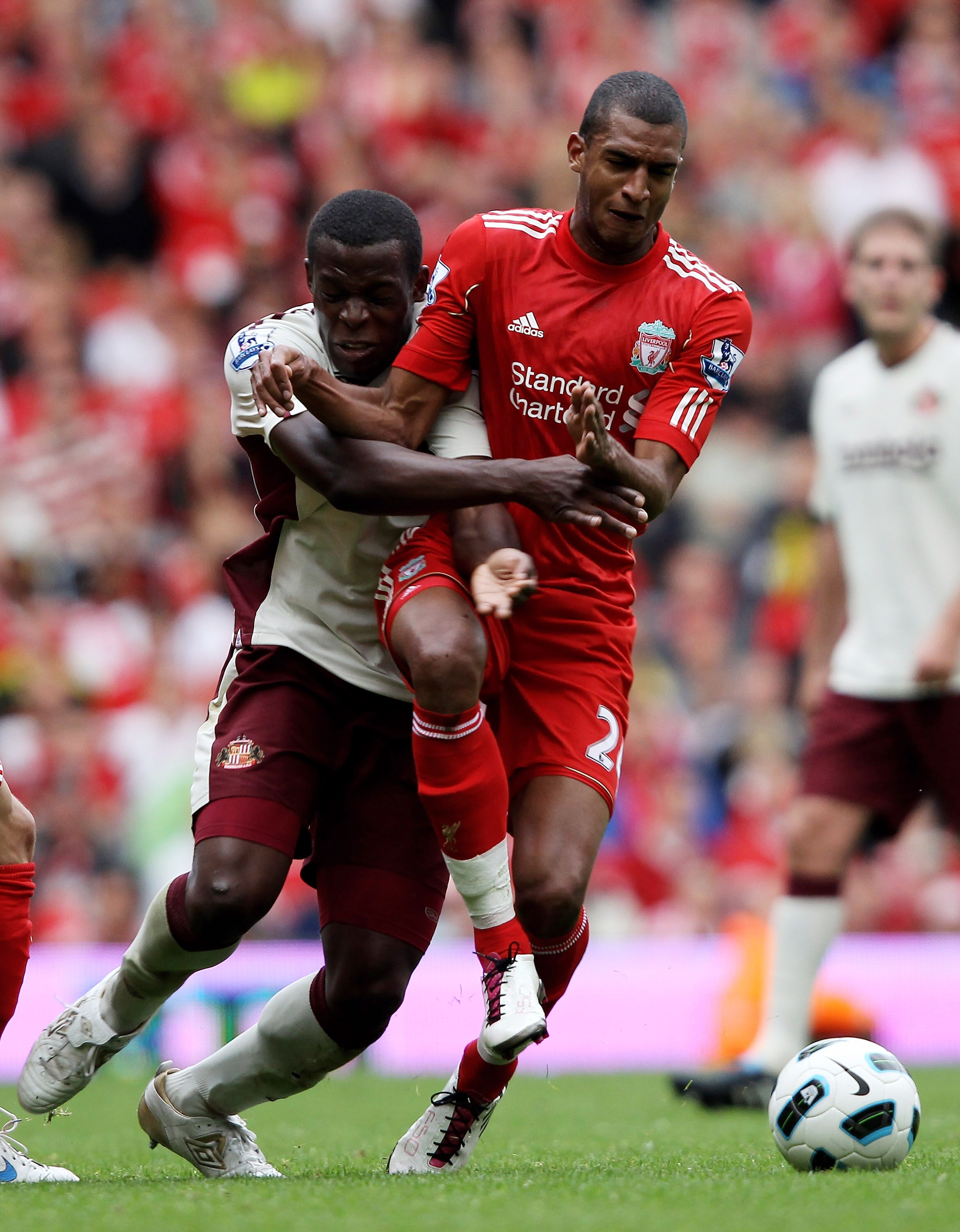 LIVERPOOL, ENGLAND - SEPTEMBER 25:  David Ngog of Liverpool clashes with Nedum Onuoha of Sunderland during the Barclays Premier League match between Liverpool and Sunderland at at Anfield on September 25, 2010 in Liverpool, England.  (Photo by Clive Bruns