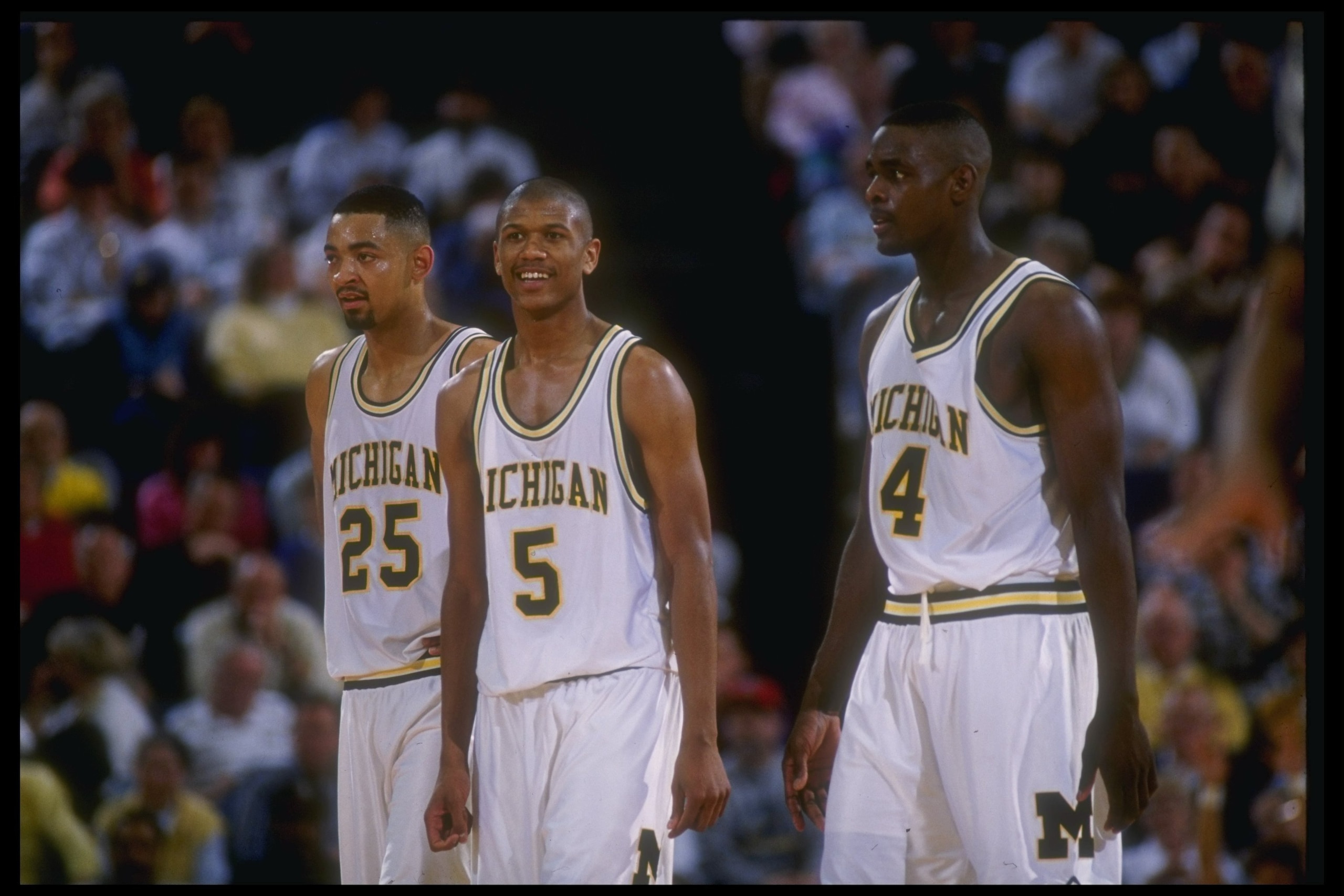 8 Mar 1992: Michigan Wolverines forward Juwan Howard, guard Jalen Rose, and forward Chris Webber (l to r) look on during a game against the Indiana Pacers. 8 Mar 1992: Michigan Wolverines forward Juwan Howard, guard Jalen Rose, and forward Chris Webber (l to r) look on during a game against the Indiana Pacers.