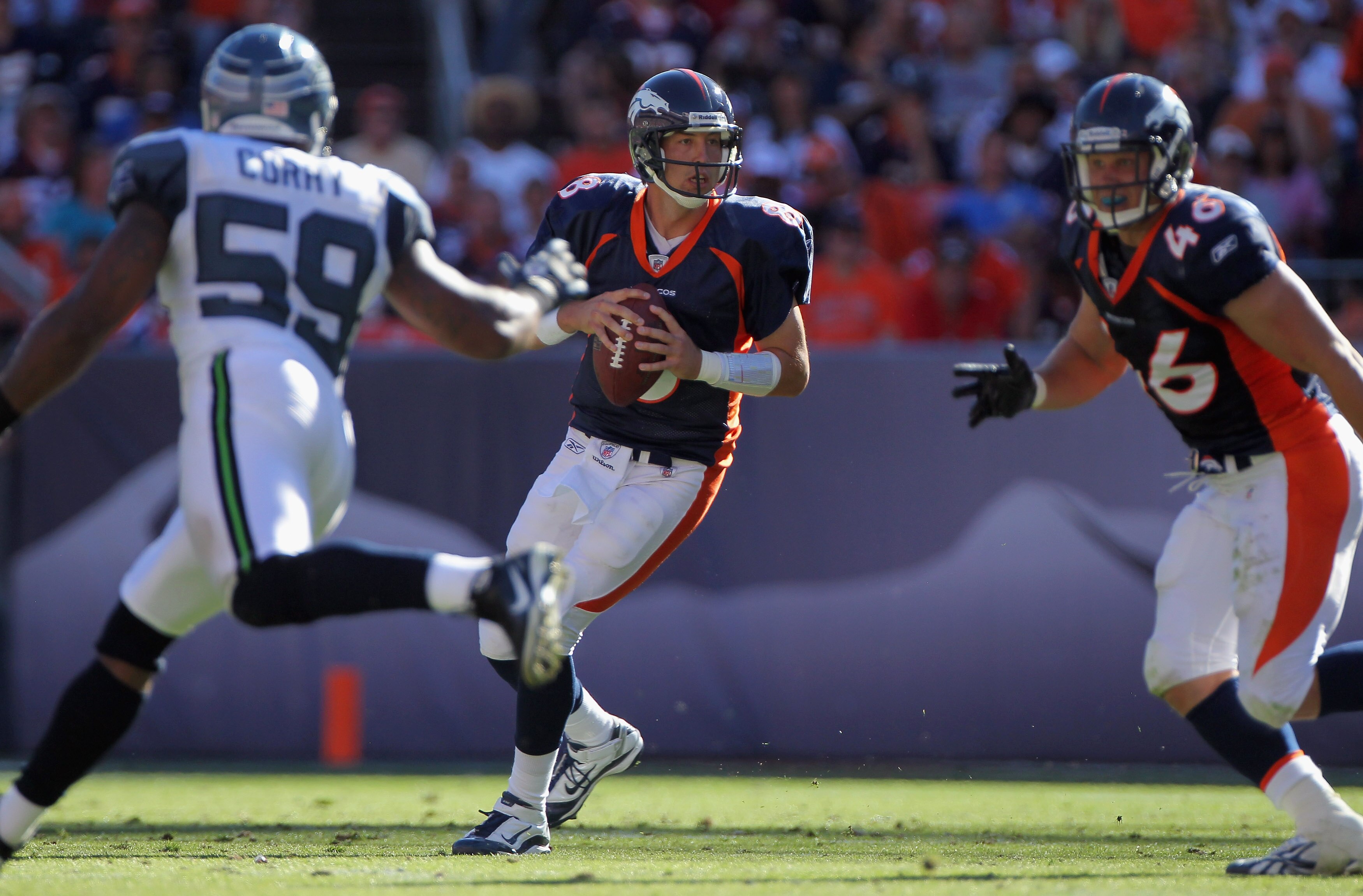 DENVER - SEPTEMBER 19:  Quarterback Kyle Orton #8 of the Denver Broncos drops back to pass against the Seattle Seahawks at INVESCO Field at Mile High on September 19, 2010 in Denver, Colorado. The Broncos defeated the Seahawks 31-14.  (Photo by Doug Pensi