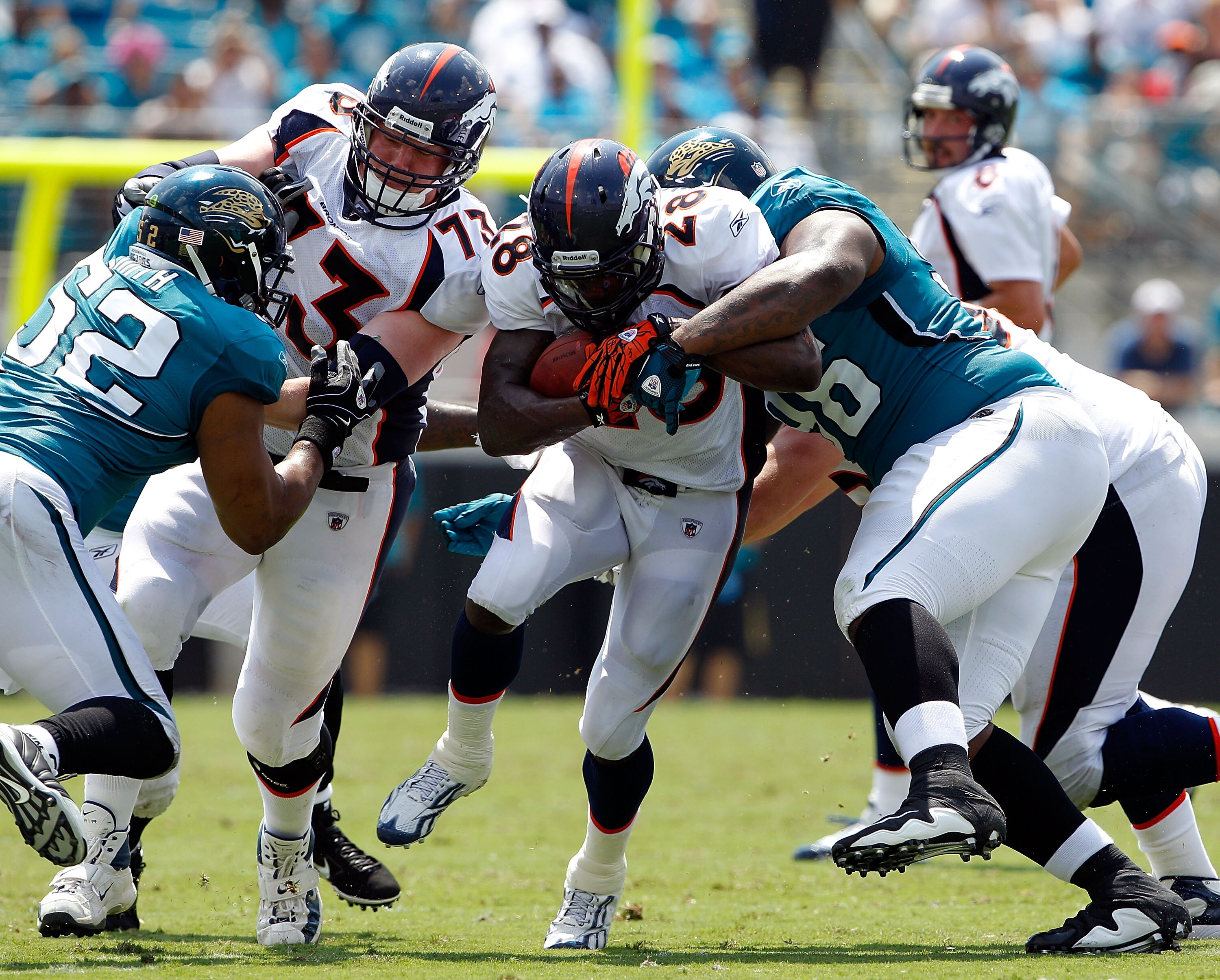 JACKSONVILLE, FL - SEPTEMBER 12:  Terrance Knighton #96 of the Jacksonville Jaguars attempts to tackle Correll Buckhalter #28 of the Denver Broncos during the NFL season opener game at EverBank Field on September 12, 2010 in Jacksonville, Florida.  (Photo