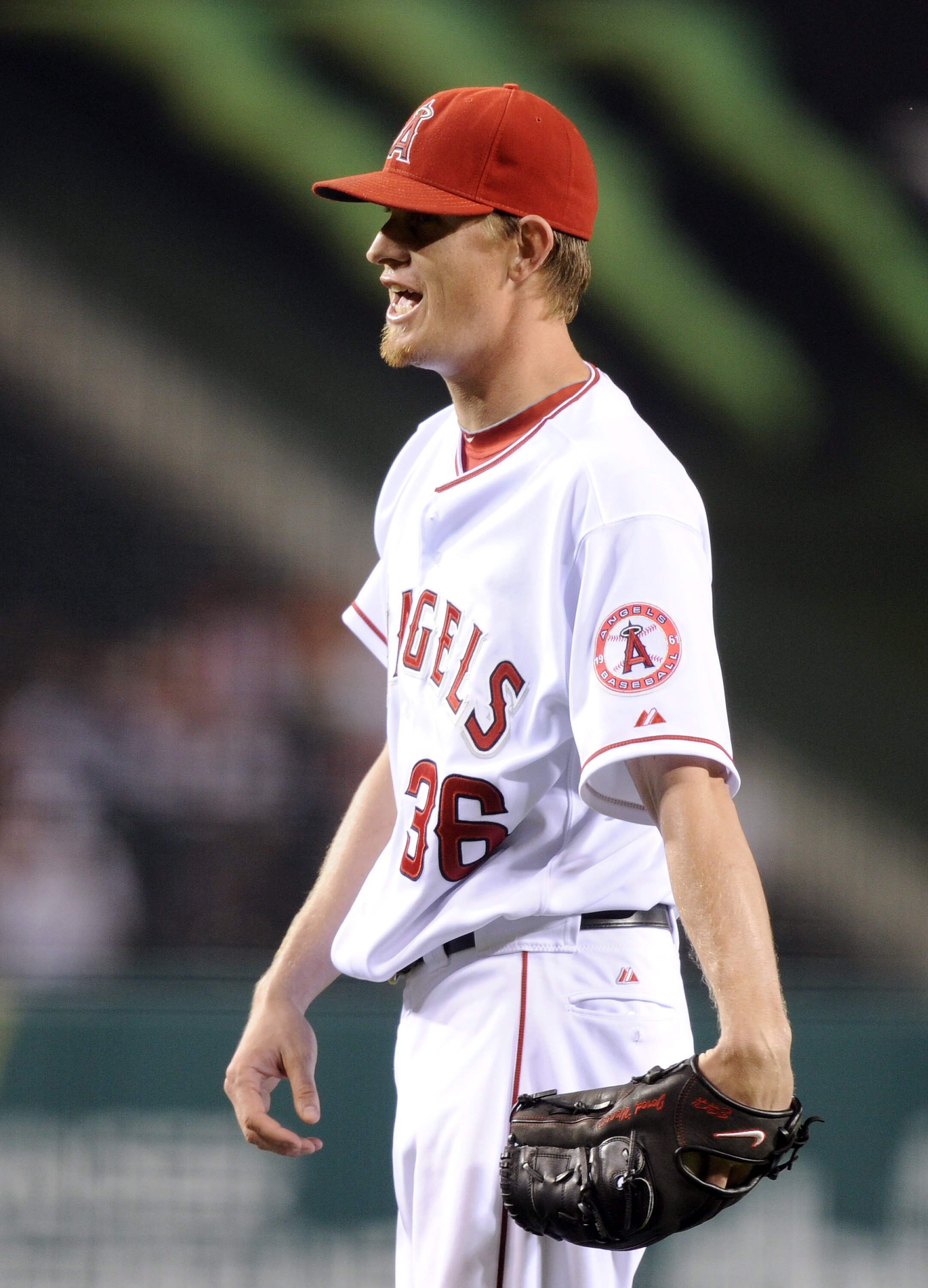 ANAHEIM, CA - SEPTEMBER 20:  Jered Weaver #36 of the Los Angeles Angels of Anaheim reacts to a long popfly out from Vladimir Guerrero #27 of the Texas Rangers during the first inning at Angel Stadium on September 20, 2010 in Anaheim, California.  (Photo b