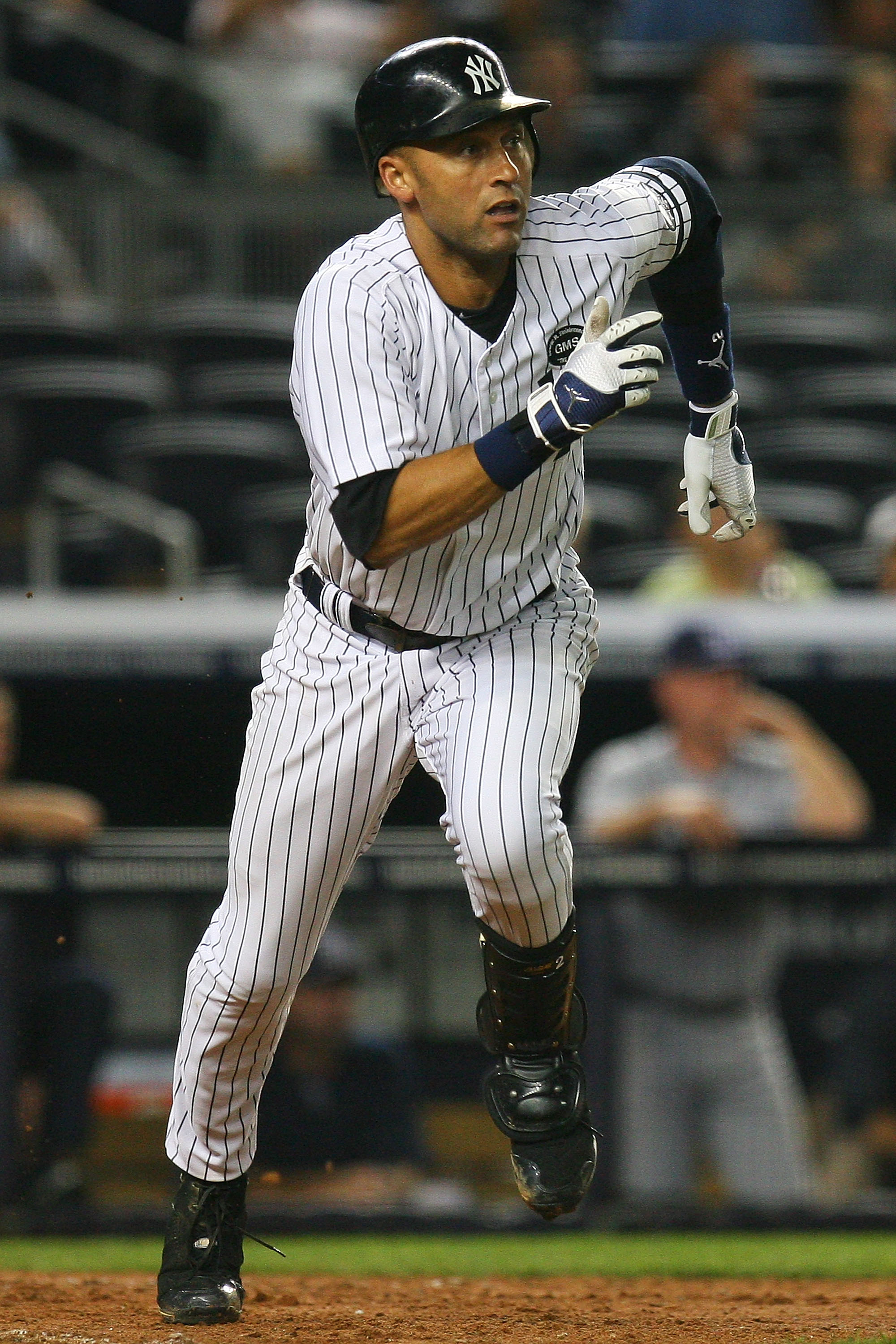 NEW YORK - SEPTEMBER 22:  Derek Jeter #2 of the New York Yankees runs on a single hit during the eighth inning against the Tampa Bay Rays on September 22, 2010 at Yankee Stadium in the Bronx borough of New York City.  (Photo by Andrew Burton/Getty Images)