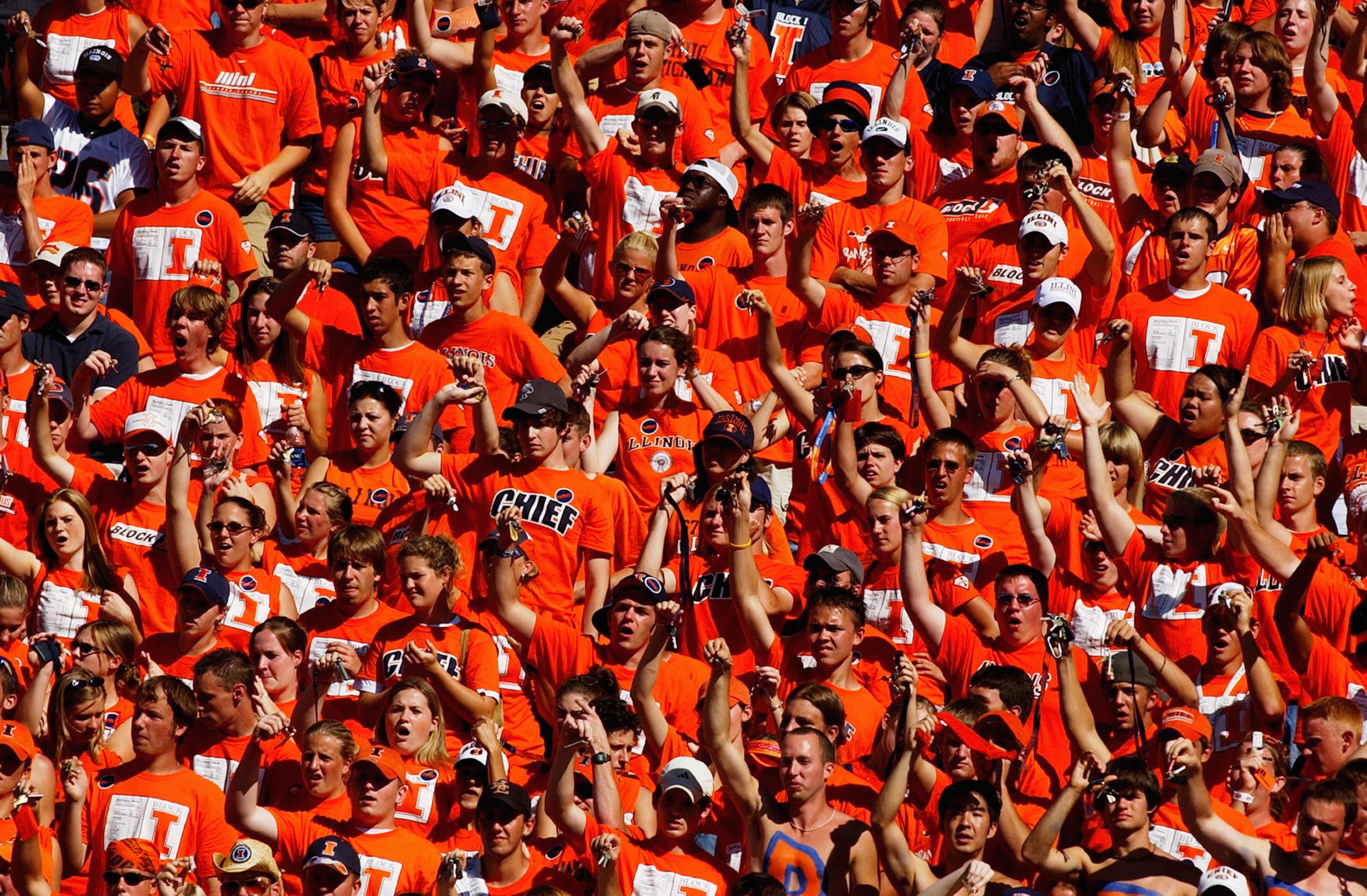CHAMPAIGN, IL - SEPTEMBER 25:  University of Illinois Fighting Illini fans cheer during the game against the Purdue University Boilermakers on September 25, 2004 at Memorial Stadium in Champaign, Illinois.  Purdue defeated Illinois 38-30.  (Photo by Jonat