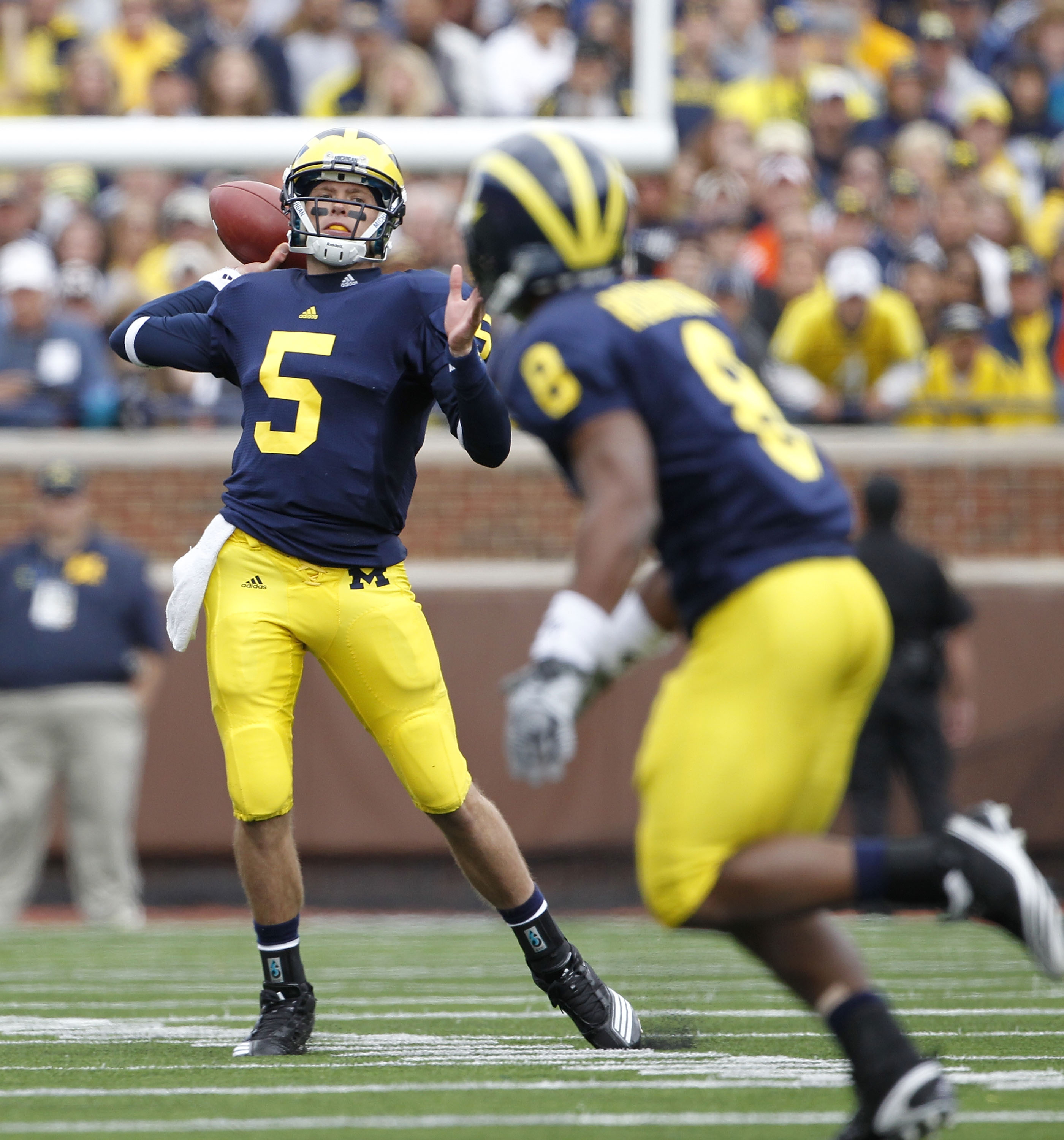 ANN ARBOR, MI - SEPTEMBER 25:  Tate Forcier #5 of the Michigan Wolverines drops back to pass during the second quarter of the game against Bowling Green on September 25, 2010 at Michigan Stadium in Ann Arbor, Michigan. Michigan defeated Bowling Green 65-2