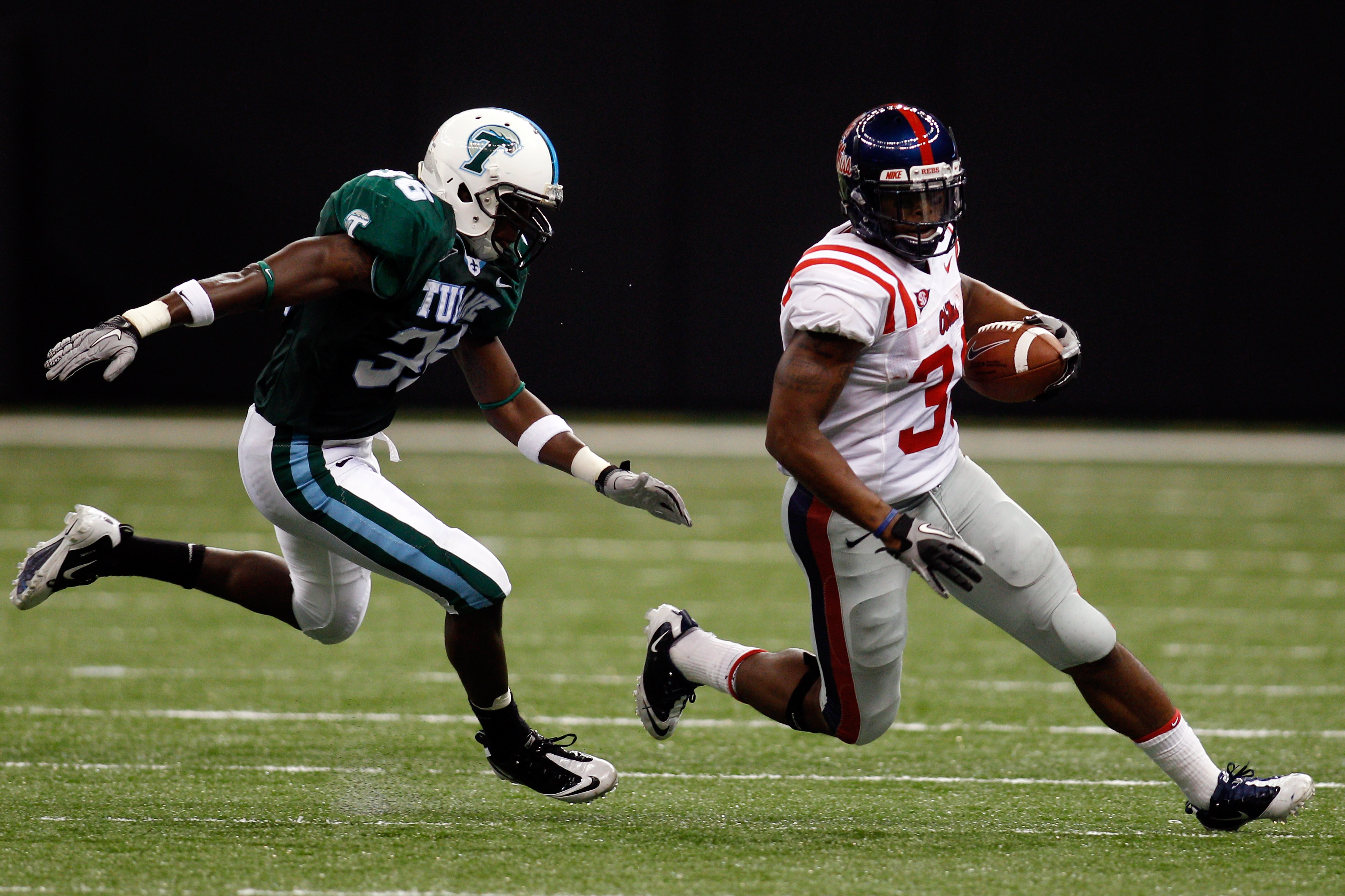 NEW ORLEANS - SEPTEMBER 11: Brandon Bolden #34 of the Ole Miss Rebels is chased by Dominique Robertson #36 of the Tulane Green Wave at the Louisiana Superdome on September 11, 2010 in New Orleans, Louisiana. (Photo by Chris Graythen/Getty Images) NEW ORLEANS - SEPTEMBER 11: Brandon Bolden #34 of the Ole Miss Rebels is chased by Dominique Robertson #36 of the Tulane Green Wave at the Louisiana Superdome on September 11, 2010 in New Orleans, Louisiana. (Photo by Chris Graythen/Getty Images)