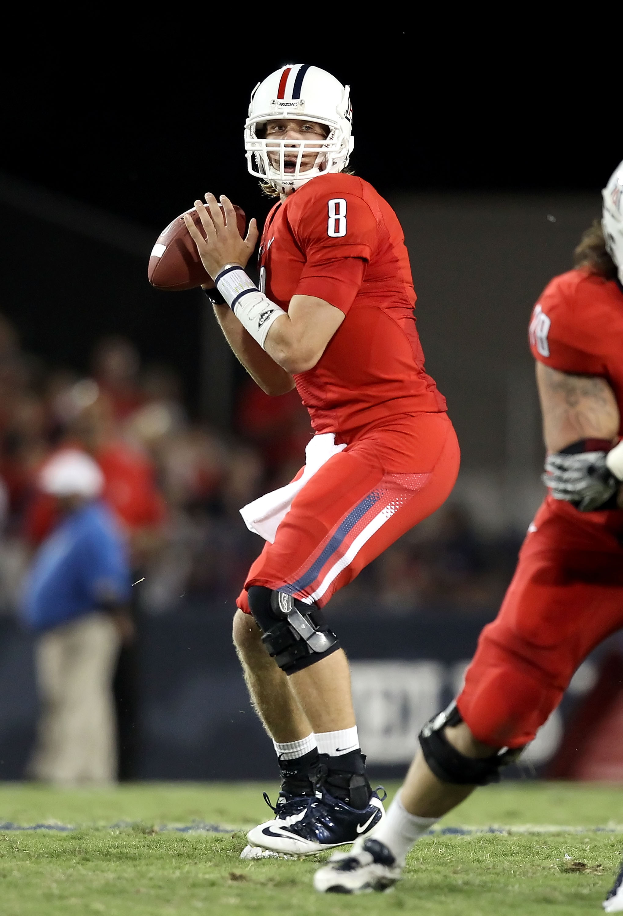TUCSON, AZ - SEPTEMBER 25:  Quarterback Nick Foles #8 of the Arizona Wildcats drops back to pass during the first quarter of the college football game against the California Bears at Arizona Stadium on September 25, 2010 in Tucson, Arizona.  (Photo by Chr