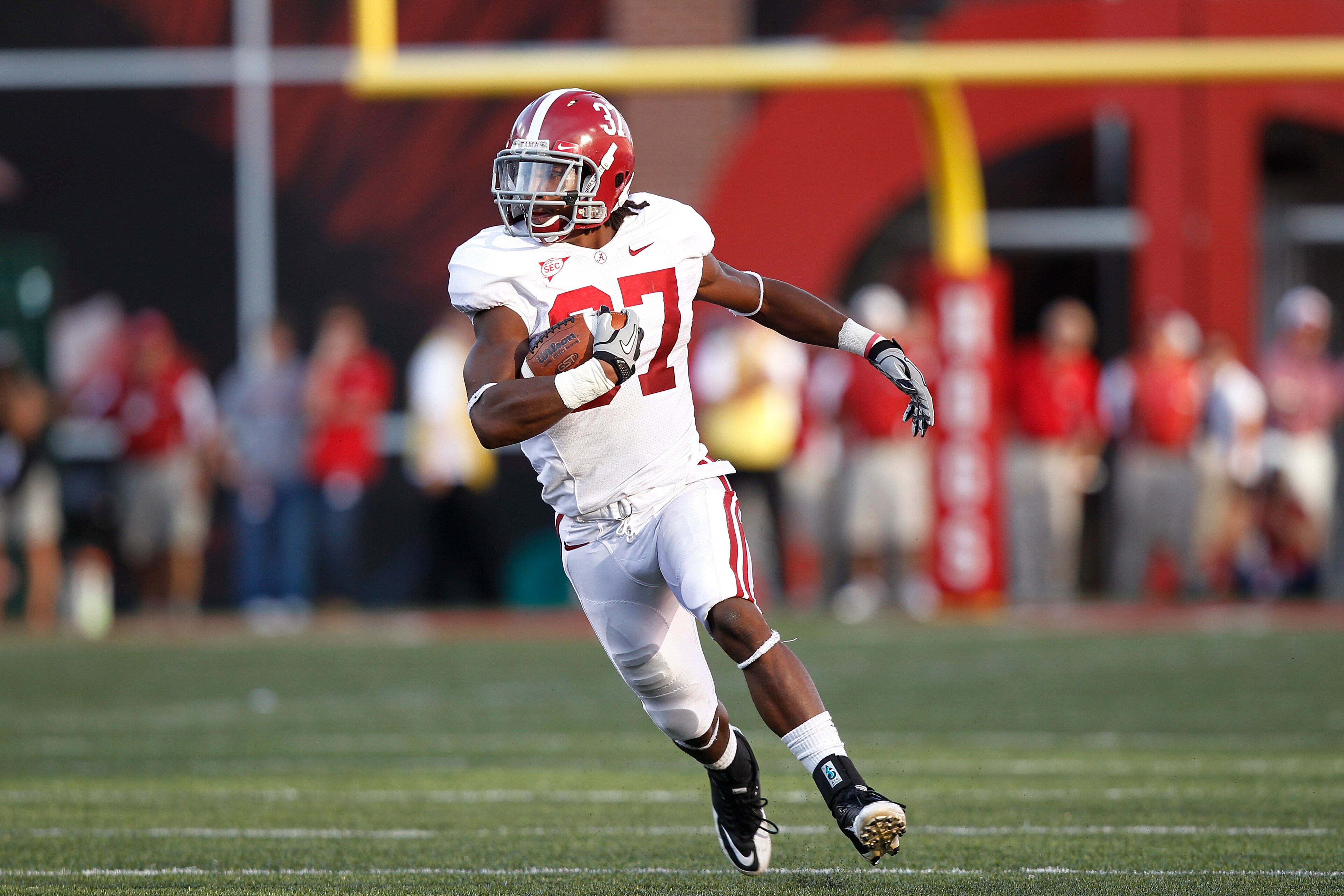 FAYETTEVILLE - SEPTEMBER 25: Robert Lester #37 of the Alabama Crimson Tide returns an interception to set up the game winning score against the Arkansas Razorbacks at Donald W. Reynolds Razorback Stadium on September 25, 2010 in Fayetteville, Arkansas. Al FAYETTEVILLE - SEPTEMBER 25: Robert Lester #37 of the Alabama Crimson Tide returns an interception to set up the game winning score against the Arkansas Razorbacks at Donald W. Reynolds Razorback Stadium on September 25, 2010 in Fayetteville, Arkansas. Al