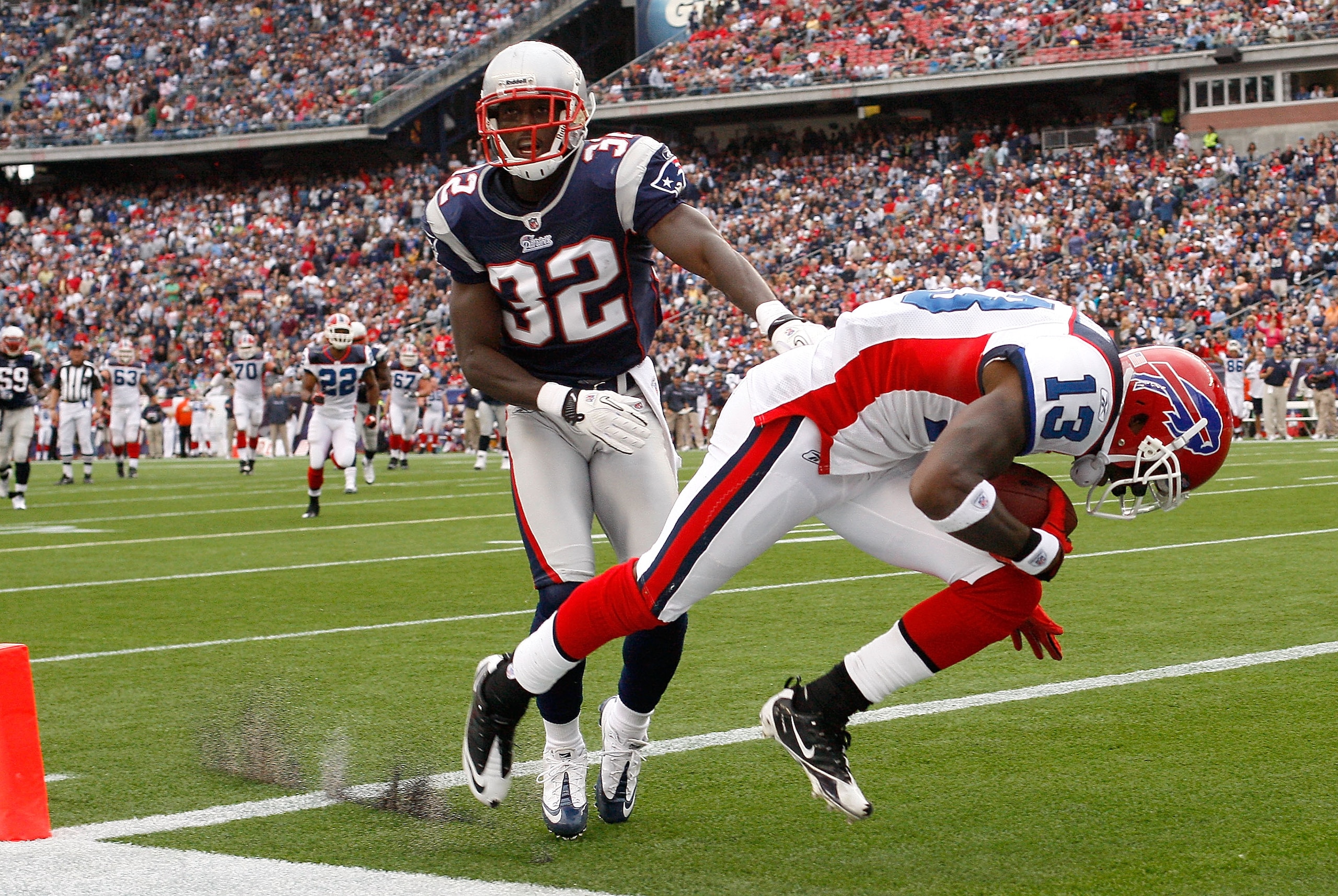 FOXBORO, MA - SEPTEMBER 26:  Steve Johnson #13 of  the Buffalo Bills scores a touchdown against the defense of Devin McCourty #32 of the New England Patriots in the second half at Gillette Stadium on September 26, 2010 in Foxboro, Massachusetts. (Photo by