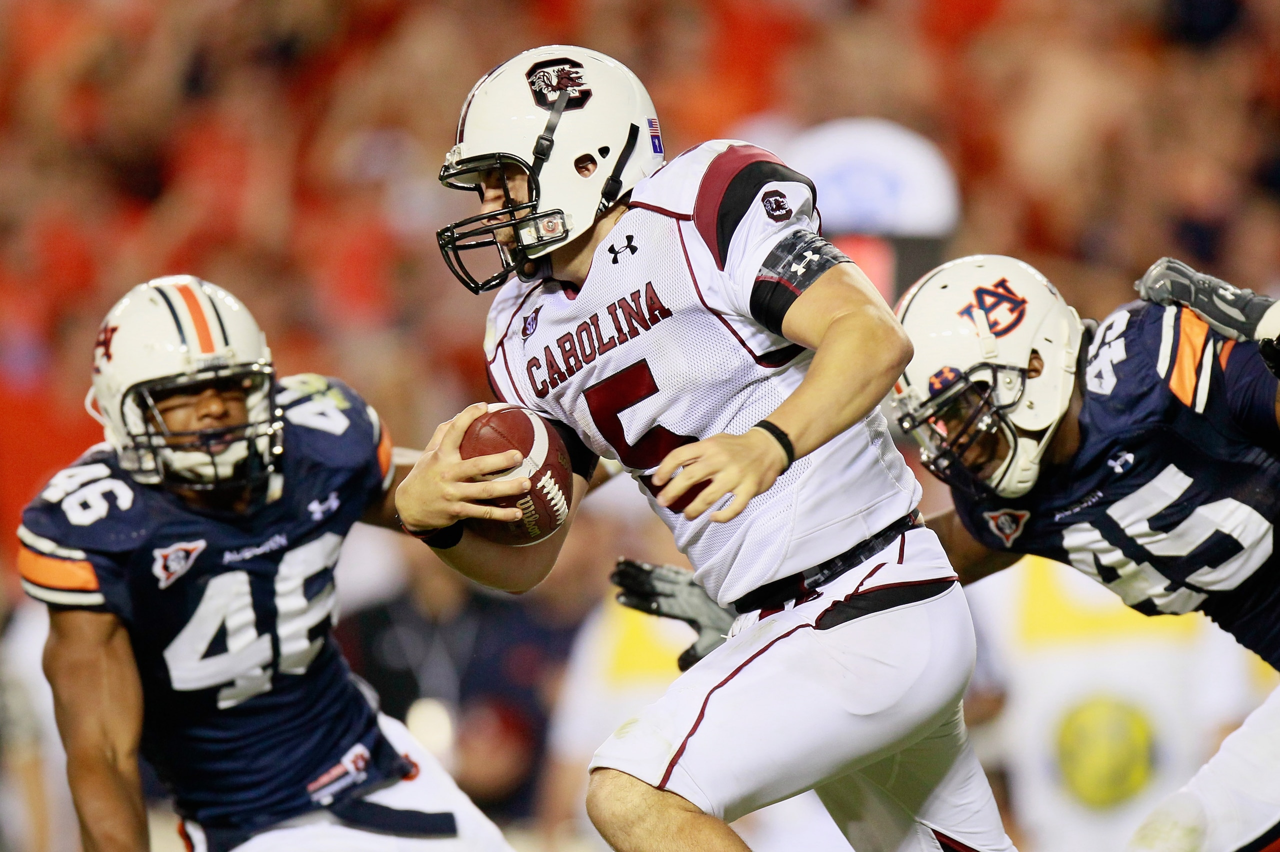 AUBURN, AL - SEPTEMBER 25: Quarterback Stephen Garcia #5 of the South Carolina Gamecocks rushes upfield against Craig Stevens #46 and Antoine Carter #45 of the Auburn Tigers at Jordan-Hare Stadium on September 25, 2010 in Auburn, Alabama. (Photo by Kevi AUBURN, AL - SEPTEMBER 25: Quarterback Stephen Garcia #5 of the South Carolina Gamecocks rushes upfield against Craig Stevens #46 and Antoine Carter #45 of the Auburn Tigers at Jordan-Hare Stadium on September 25, 2010 in Auburn, Alabama. (Photo by Kevi