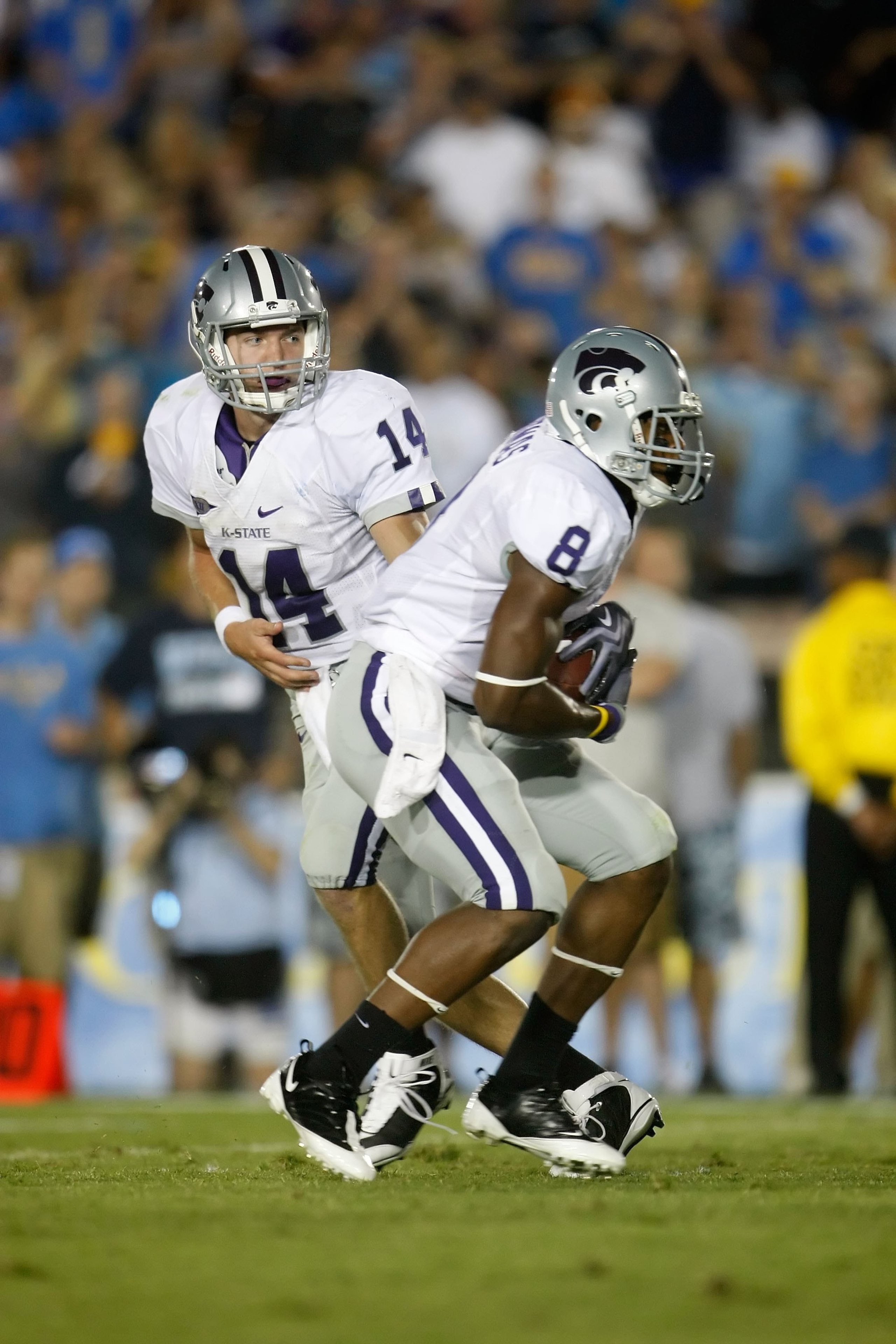 PASADENA, CA - SEPTEMBER 19: Quarterback Carson Coffman #14 of the Kansas State Wildcats hands the ball off to Daniel Thomas #8 against the UCLA Bruins at the Rose Bowl on September 19, 2009 in Pasadena, California. UCLA defeated Kansas State 23-9. (Pho PASADENA, CA - SEPTEMBER 19: Quarterback Carson Coffman #14 of the Kansas State Wildcats hands the ball off to Daniel Thomas #8 against the UCLA Bruins at the Rose Bowl on September 19, 2009 in Pasadena, California. UCLA defeated Kansas State 23-9. (Pho