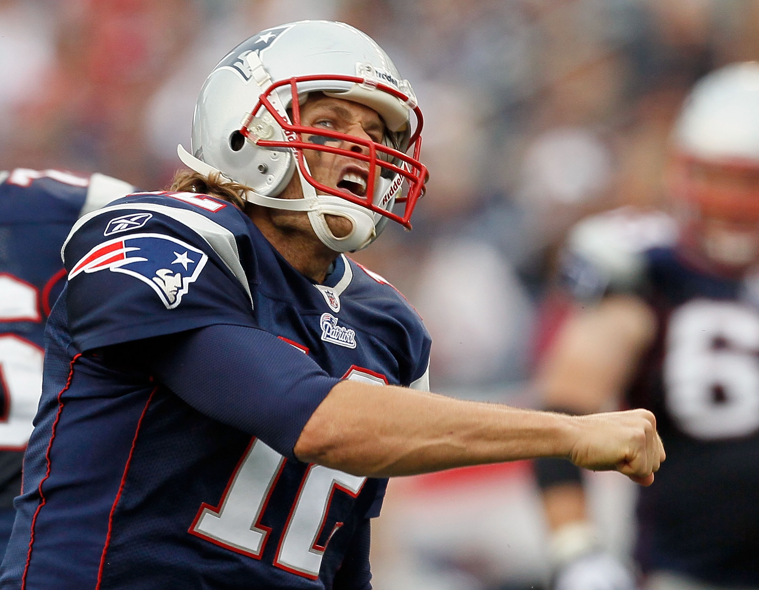 FOXBORO, MA - SEPTEMBER 26:  Tom Brady #12 of the New England Patriots reacts after running the ball for a first down against the Buffalo Bills in the second half at Gillette Stadium on September 26, 2010 in Foxboro, Massachusetts. (Photo by Jim Rogash/Ge