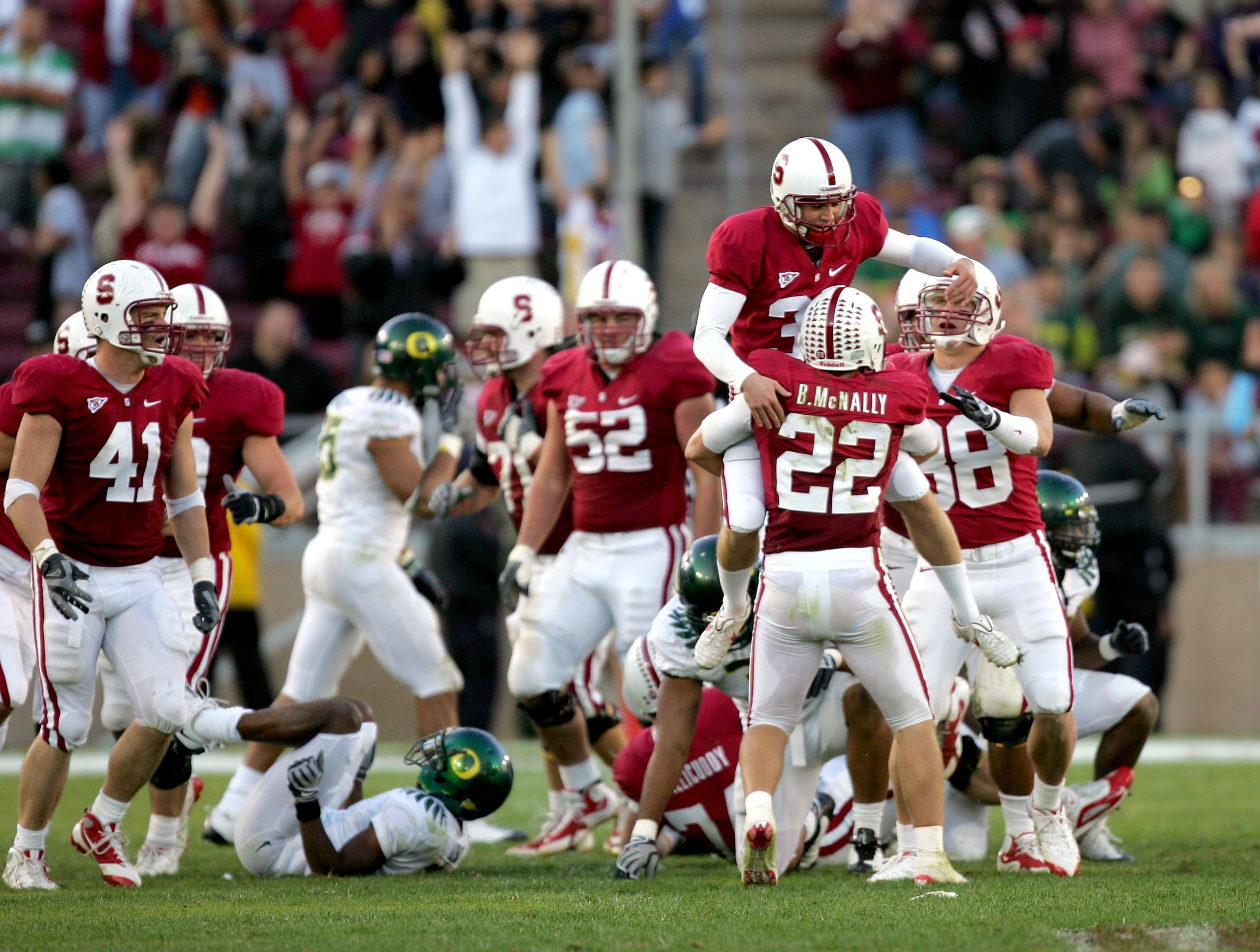 PALO ALTO, CA - NOVEMBER 07:  Nate Whitaker #39 of the Stanford Cardinal jumps in to the arms of Bo McNally #22 after Whitaker kicks a field goal that clinched their upset win over the Oregon Ducks at Stanford Stadium on November 7, 2009 in Palo Alto, Cal