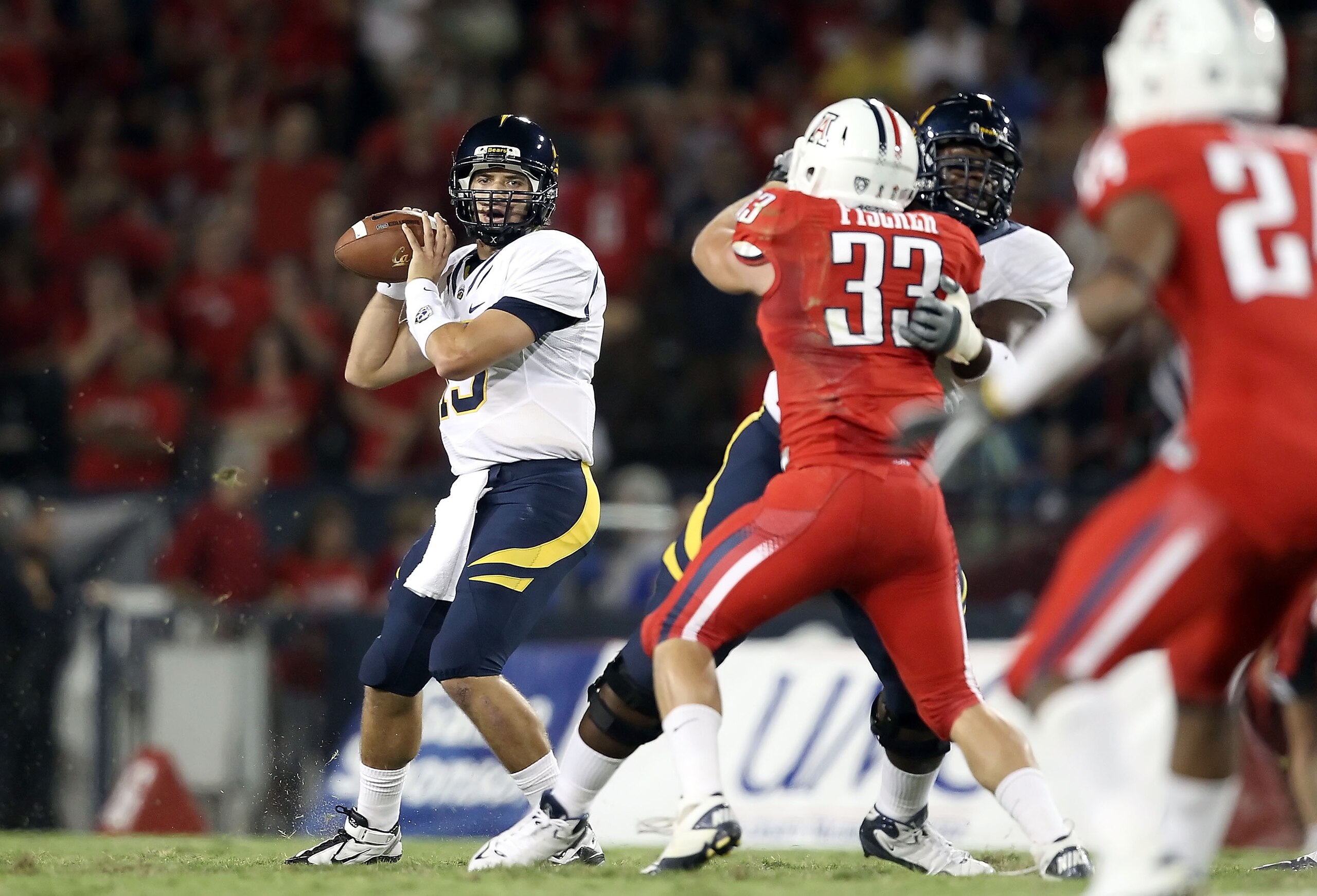 TUCSON, AZ - SEPTEMBER 25:  Quarterback Kevin Riley #13 of the California Bears drops back to pass during the college football game against the Arizona Wildcats at Arizona Stadium on September 25, 2010 in Tucson, Arizona.  (Photo by Christian Petersen/Get