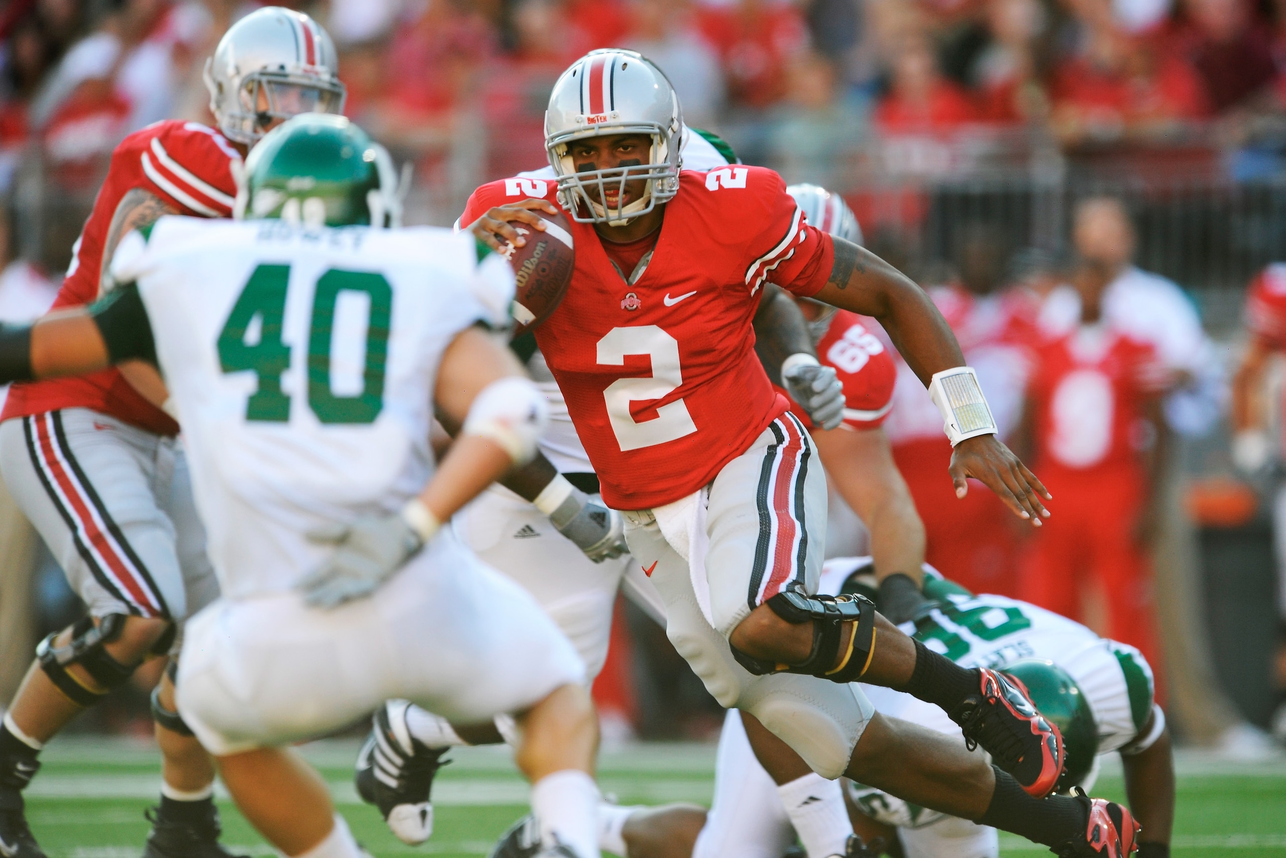 COLUMBUS, OH - SEPTEMBER 25:  Quarterback Terrelle Pryor #2 of the Ohio State Buckeyes picks up yardage on the run as Neal Howey #40 of the Eastern Michigan Eagles prepares to defend at Ohio Stadium on September 25, 2010 in Columbus, Ohio.  (Photo by Jami