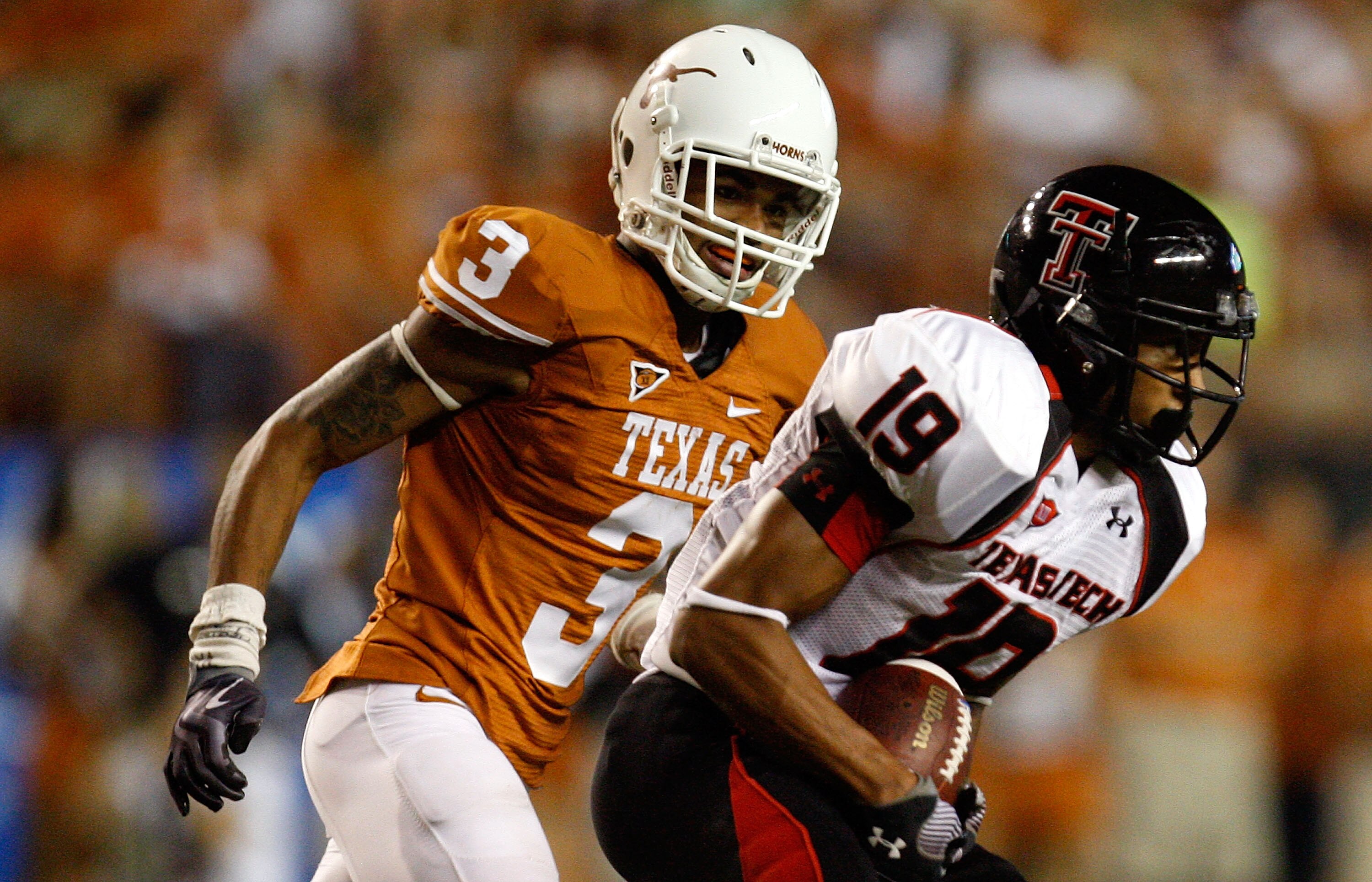 AUSTIN, TX - SEPTEMBER 19: Wide receiver Lyle Leong #19 of the Texas Tech Red Raiders runs the ball past Curtis Brown #3 of the Texas Longhorns at Darrell K Royal-Texas Memorial Stadium on September 19, 2009 in Austin, Texas. (Photo by Ronald Martinez/G AUSTIN, TX - SEPTEMBER 19: Wide receiver Lyle Leong #19 of the Texas Tech Red Raiders runs the ball past Curtis Brown #3 of the Texas Longhorns at Darrell K Royal-Texas Memorial Stadium on September 19, 2009 in Austin, Texas. (Photo by Ronald Martinez/G