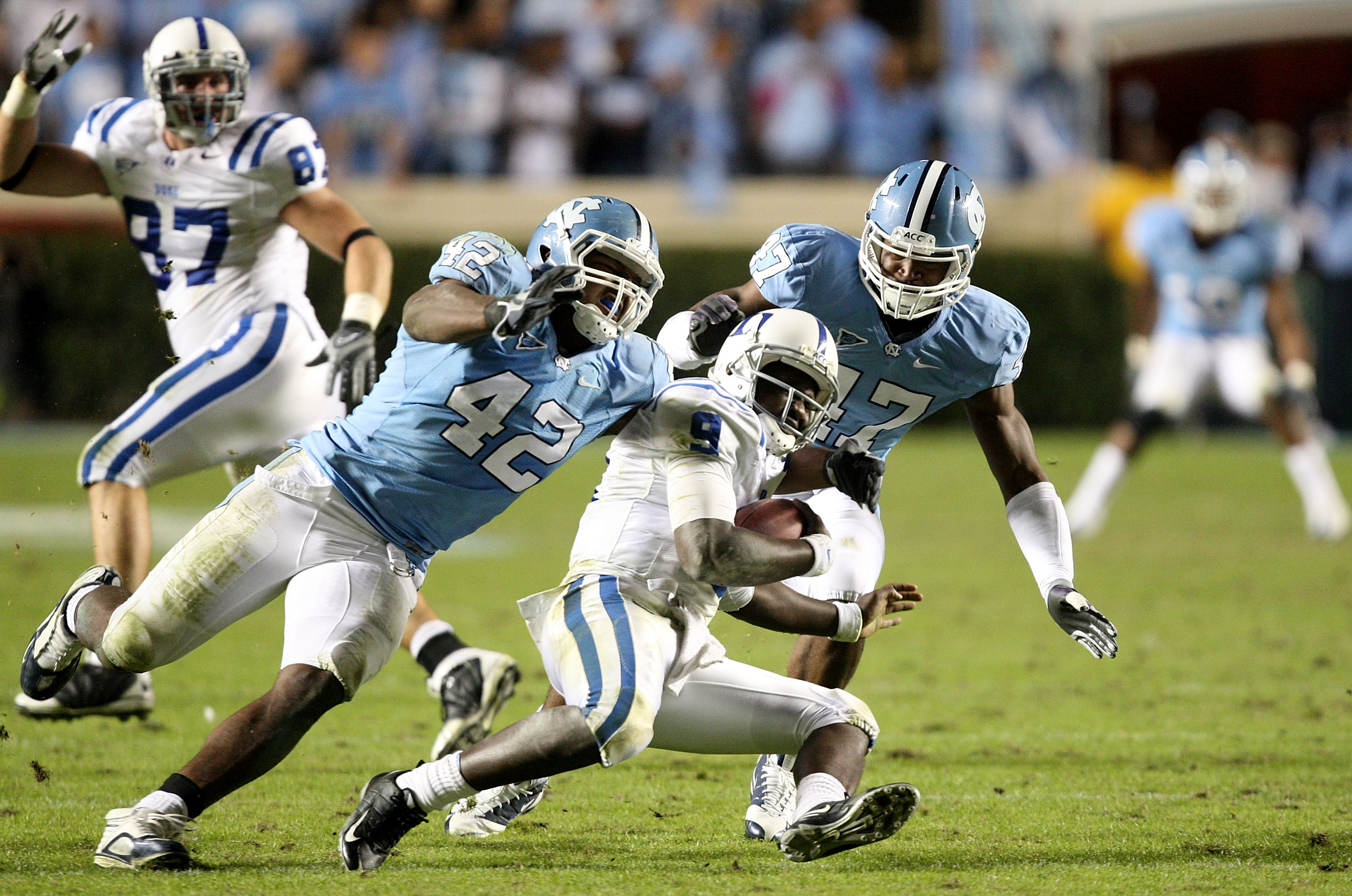 CHAPEL HILL, NC - NOVEMBER 07: Thaddeus Lewis #9 of the Duke Blue Devils is sacked by Robert Quinn #42 of the North Carolina Tar Heels during their game at Kenan Stadium on November 7, 2009 in Chapel Hill, North Carolina. (Photo by Streeter Lecka/Getty CHAPEL HILL, NC - NOVEMBER 07: Thaddeus Lewis #9 of the Duke Blue Devils is sacked by Robert Quinn #42 of the North Carolina Tar Heels during their game at Kenan Stadium on November 7, 2009 in Chapel Hill, North Carolina. (Photo by Streeter Lecka/Getty