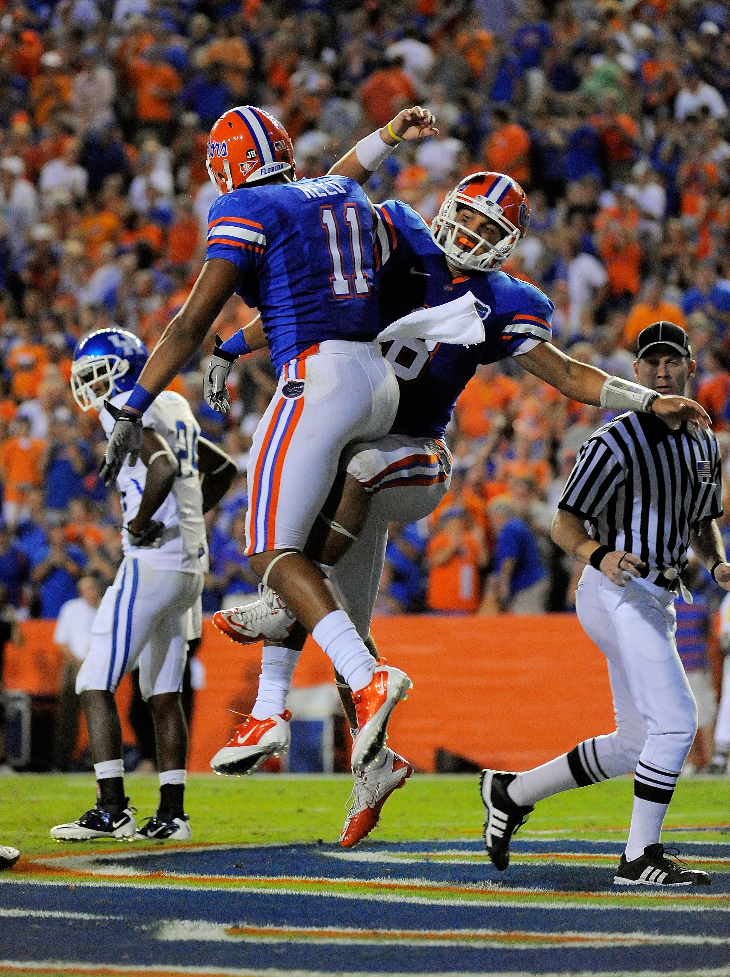 GAINESVILLE, FL - SEPTEMBER 25:  Quarterback Trey Burton #8 of the Florida Gators celebrates with tight end Jordan Reed #11 after scoring a touchdown late in the fourth quarter against the Kentucky Wildcats at Ben Hill Griffin Stadium on September 25, 201