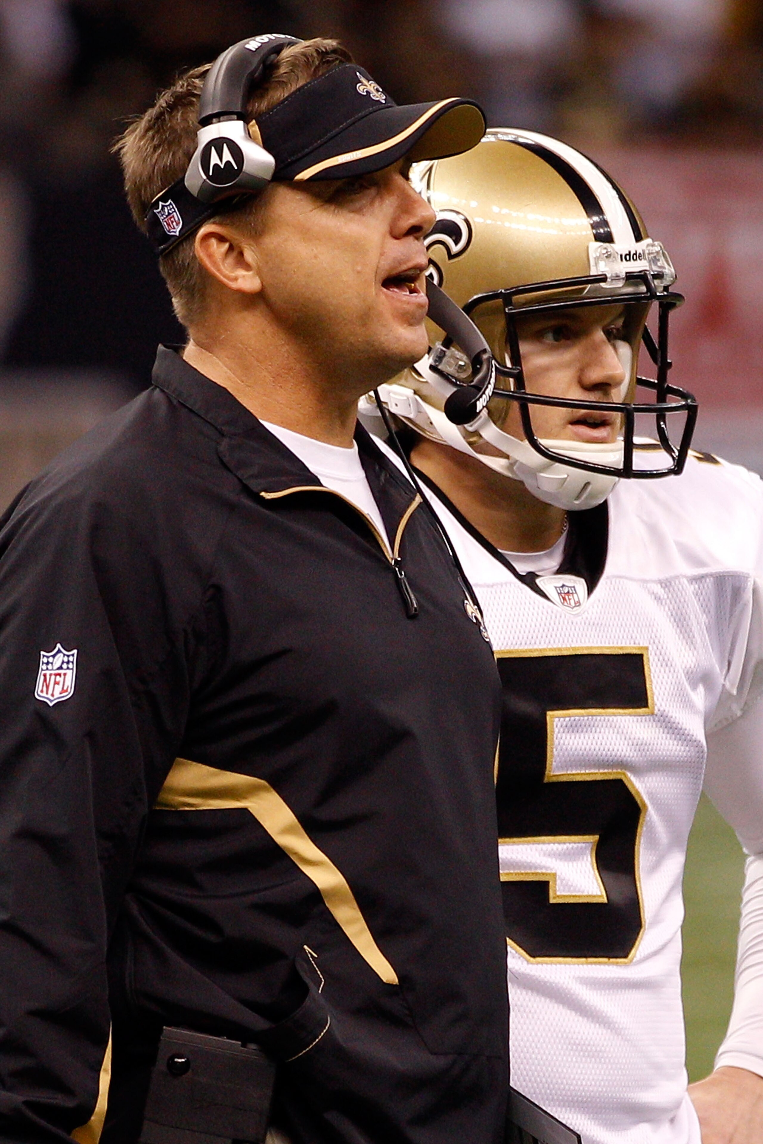 NEW ORLEANS - SEPTEMBER 26: Head Coach Sean Payton talks with Garrett Hartley #5 of the New Orleans Saints before attempting a field goal in overtime against the Atlanta Falcons at the Louisiana Superdome on September 26, 2010 in New Orleans, Louisiana. NEW ORLEANS - SEPTEMBER 26: Head Coach Sean Payton talks with Garrett Hartley #5 of the New Orleans Saints before attempting a field goal in overtime against the Atlanta Falcons at the Louisiana Superdome on September 26, 2010 in New Orleans, Louisiana.