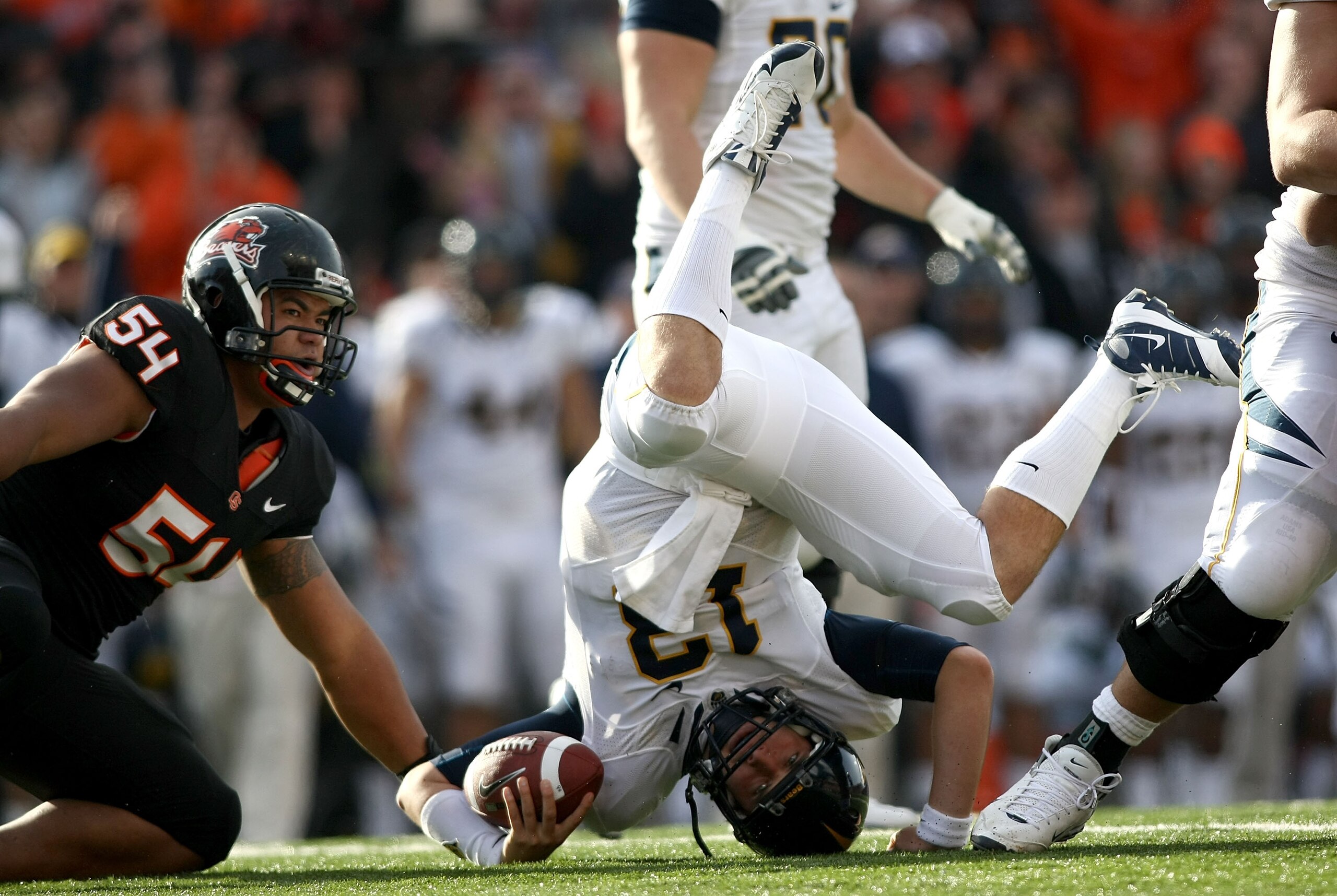 CORVALLIS, OR - NOVEMBER 15:  Quarterback Kevin Riley #13 of the California Golden Bears rolls on his head after being sacked by Stephen Paea #54 the Oregon State Beavers at Reser Stadium on November 15, 2008 in Corvalis, Oregon.  (Photo by Jonathan Ferre
