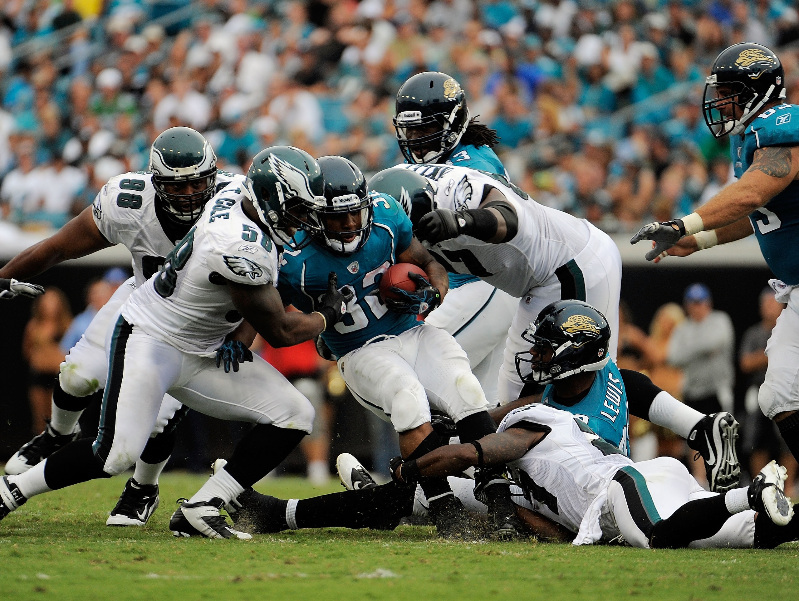 JACKSONVILLE, FL - SEPTEMBER 26: Linebacker Trent Cole #58 and defensive tackle Brodrick Bunkley #97 of the Philadelphia Eagles bring down running back Maurice Jones-Drew #32 of the Jacksonville Jaguars at EverBank Field on September 26, 2010 in Jacksonv JACKSONVILLE, FL - SEPTEMBER 26: Linebacker Trent Cole #58 and defensive tackle Brodrick Bunkley #97 of the Philadelphia Eagles bring down running back Maurice Jones-Drew #32 of the Jacksonville Jaguars at EverBank Field on September 26, 2010 in Jacksonv