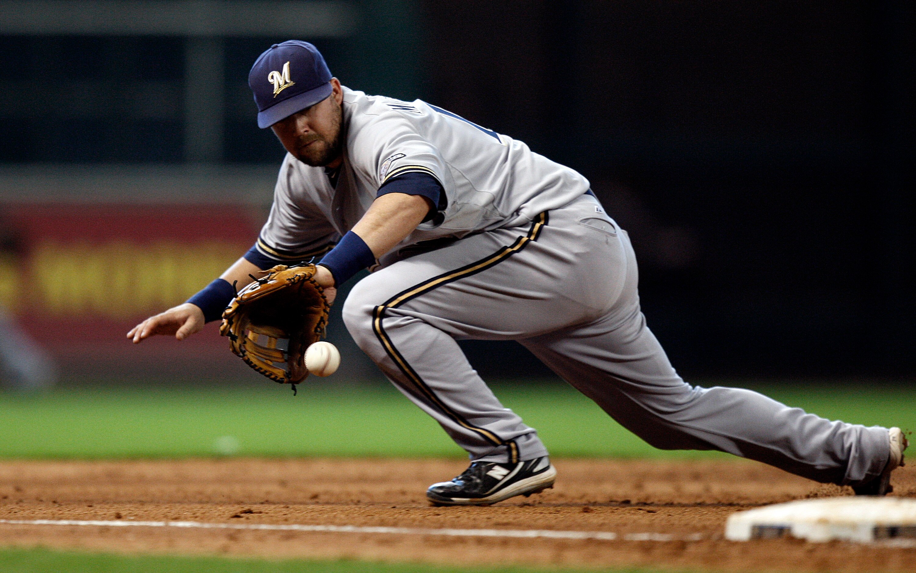 HOUSTON - SEPTEMBER 15:  Third baseman Casey McHehee #14 of the Milwaukee Brewers makes a backhand play on a ground ball hit by Angel Sanchez of the Houston Astros in the sixth inning on September 15, 2010 in Houston, Texas.  (Photo by Bob Levey/Getty Ima