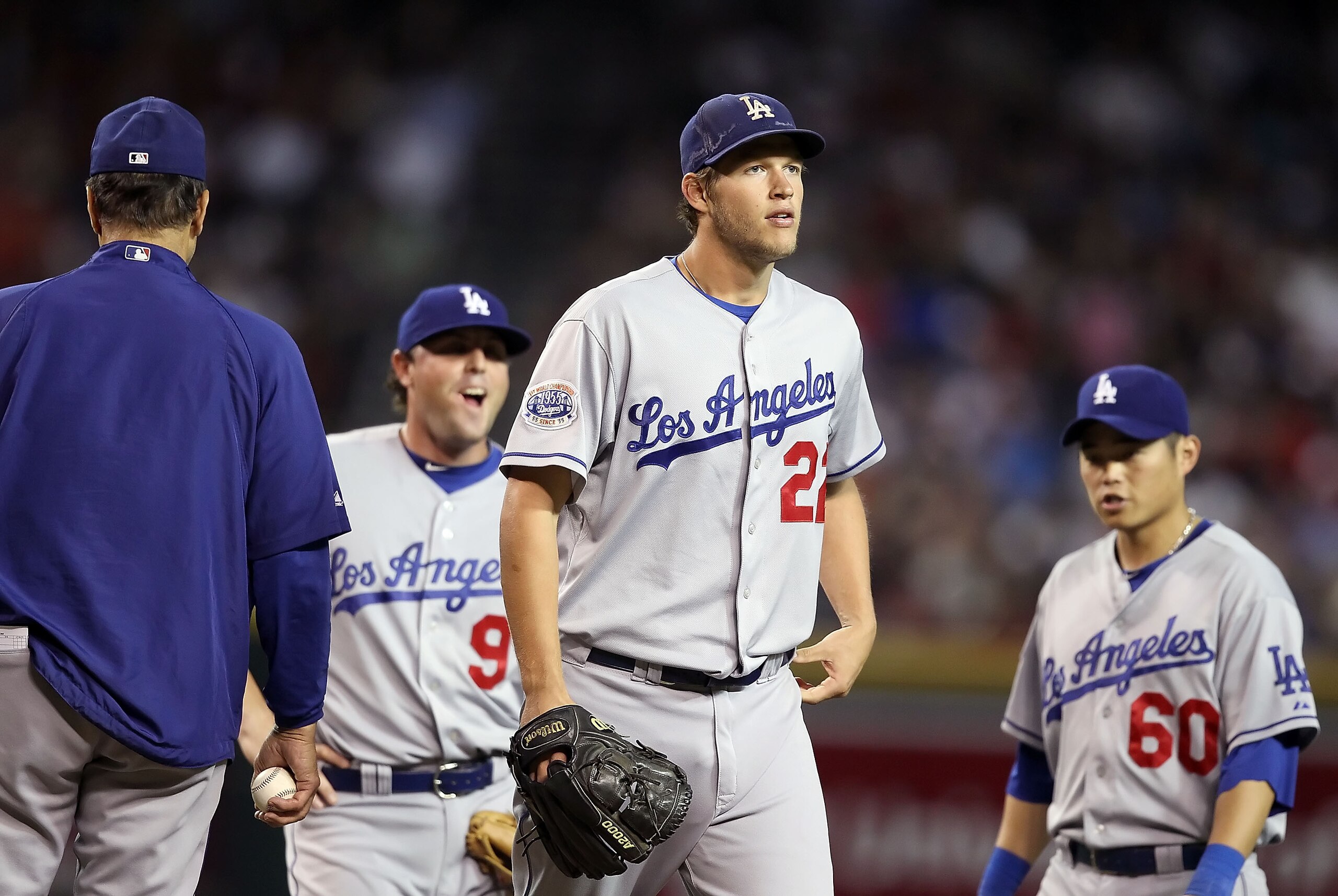 PHOENIX - SEPTEMBER 24:  Starting pitcher Clayton Kershaw #22 of the Los Angeles Dodgers is removed from the Major League Baseball game against the Arizona Diamondbacks by manager Joe Torre during the ninth inning at Chase Field on September 24, 2010 in P