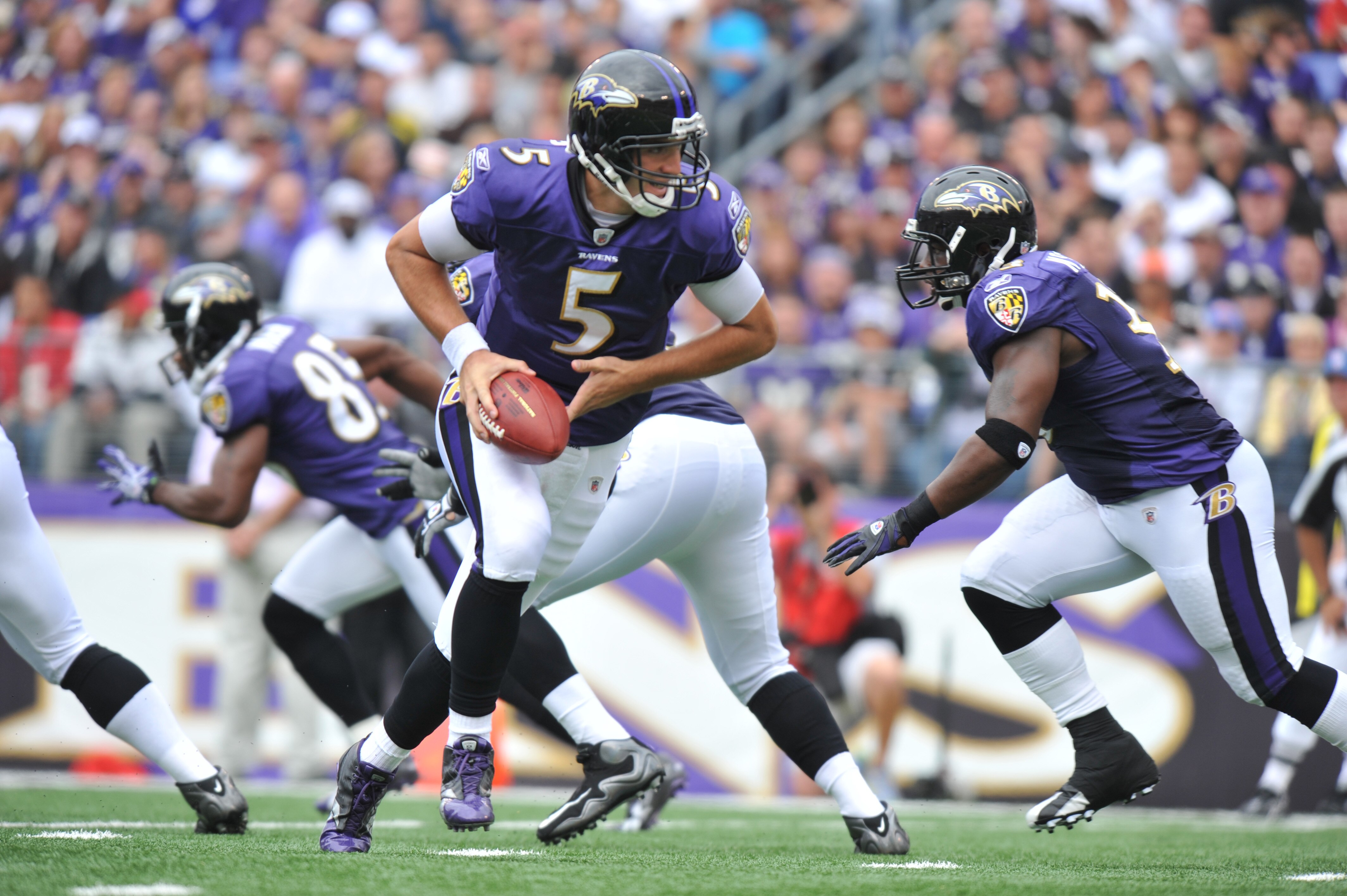 BALTIMORE - SEPTEMBER 26: Joe Flacco #5 of the Baltimore Ravens hands off against the Cleveland Browns at M&T Bank Stadium on September 26, 2010 in Baltimore, Maryland. The Ravens lead the Browns at the half 14-10. (Photo by Larry French/Getty Images) BALTIMORE - SEPTEMBER 26: Joe Flacco #5 of the Baltimore Ravens hands off against the Cleveland Browns at M&T Bank Stadium on September 26, 2010 in Baltimore, Maryland. The Ravens lead the Browns at the half 14-10. (Photo by Larry French/Getty Images)