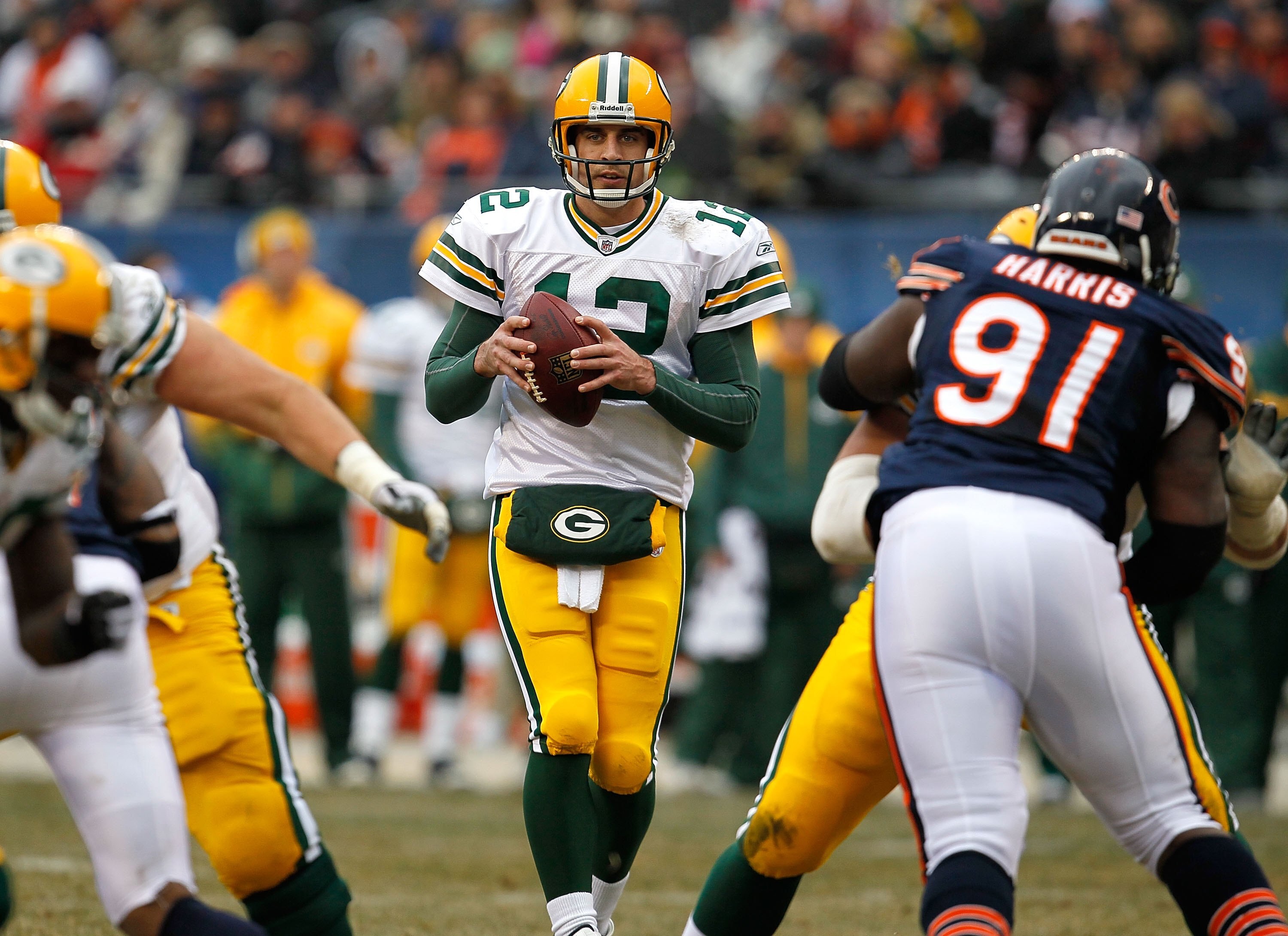 CHICAGO - DECEMBER 13: Aaron Rodgers #12 of the Green Bay Packers drops back to pass against the Chicago Bears at Soldier Field on December 13, 2009 in Chicago, Illinois. The Packers defeated the Bears 21-14. (Photo by Jonathan Daniel/Getty Images)