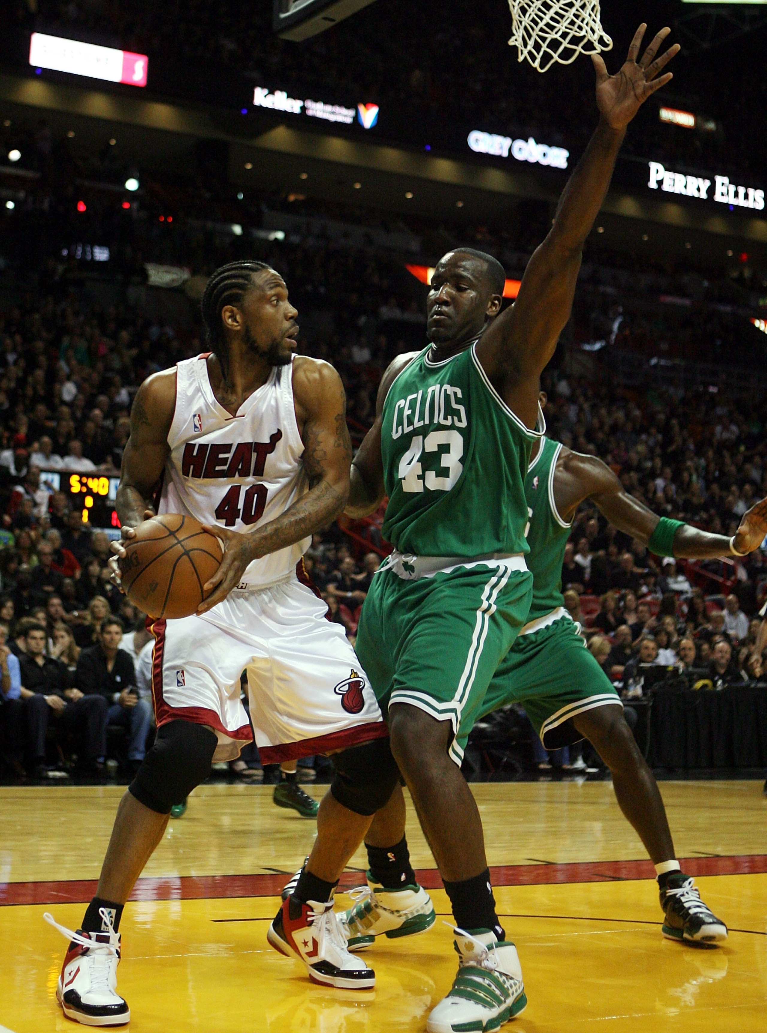 MIAMI - APRIL 23: Forward Udonis Haslem #40 of the Miami Heat is defended by center Kendrick Perkins #43 of the Boston Celtics in Game Three of the Eastern Conference Quarterfinals during the 2010 NBA Playoffs at American Airlines Arena on April 23, 2010 