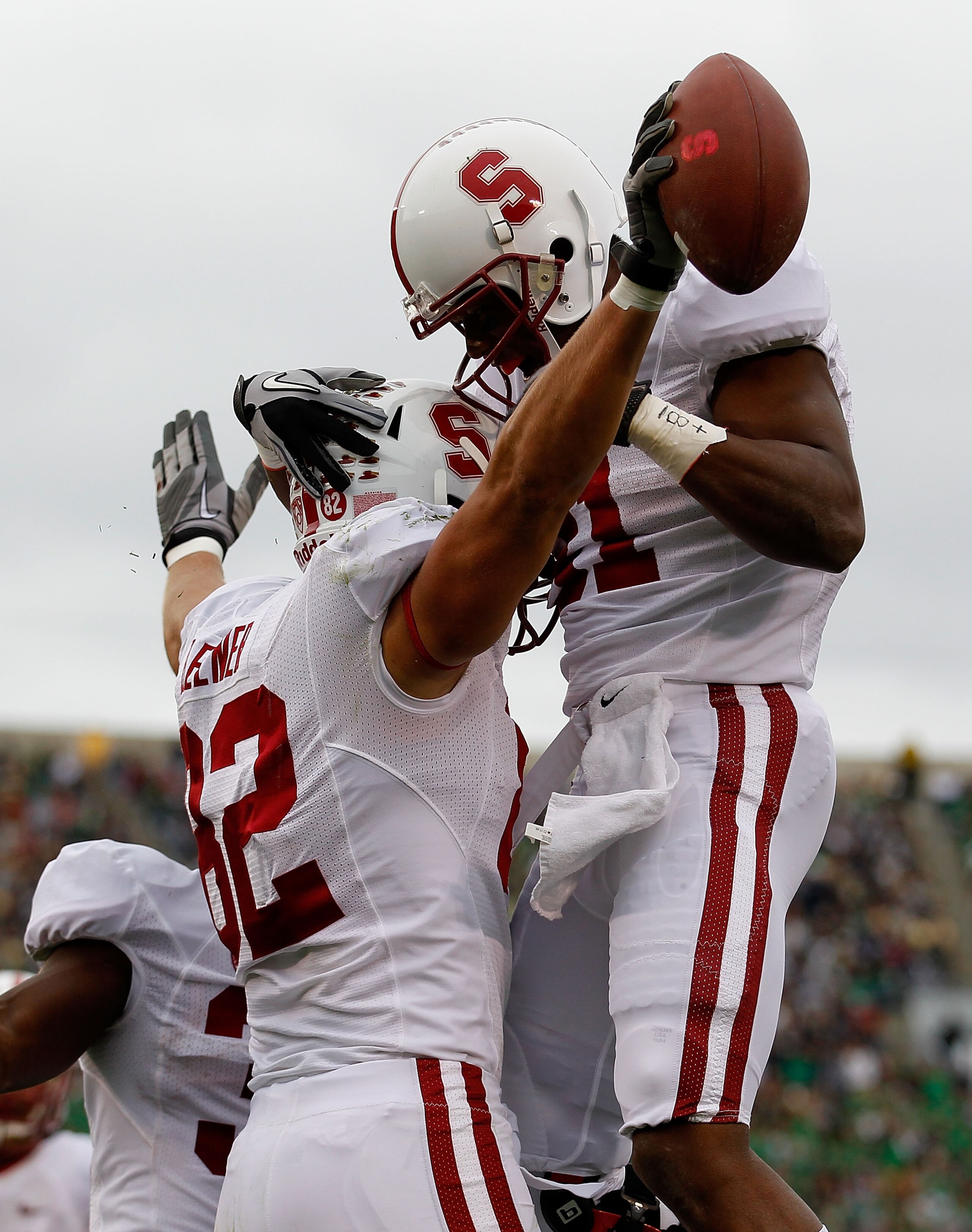 SOUTH BEND, IN - SEPTEMBER 25: Coby Fleener #82 of the Stanford Cardinal celebrates a touchdown catch with teammate Chris Owusu #81 against the Notre Dame Fighting Irish tries to defend at Notre Dame Stadium on September 25, 2010 in South Bend, Indiana. (
