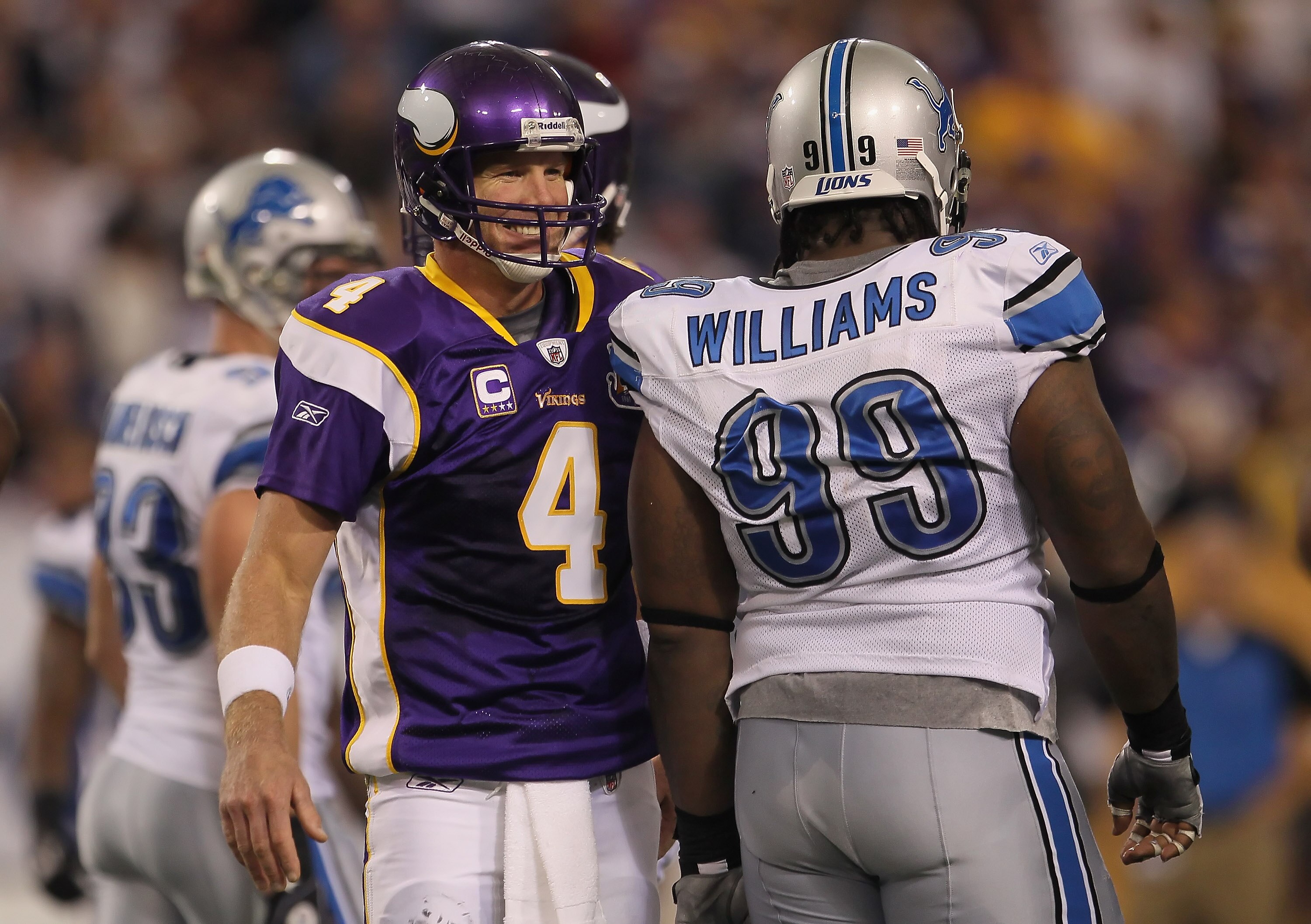 MINNEAPOLIS - SEPTEMBER 26:  Brett Favre #4 of the Minnesota Vikings and Corey Williams # 99 of the Detroit Lions share a laugh during the second half at Hubert H. Humphrey Metrodome on September 26, 2010 in Minneapolis, Minnesota. The Vikings defeated th