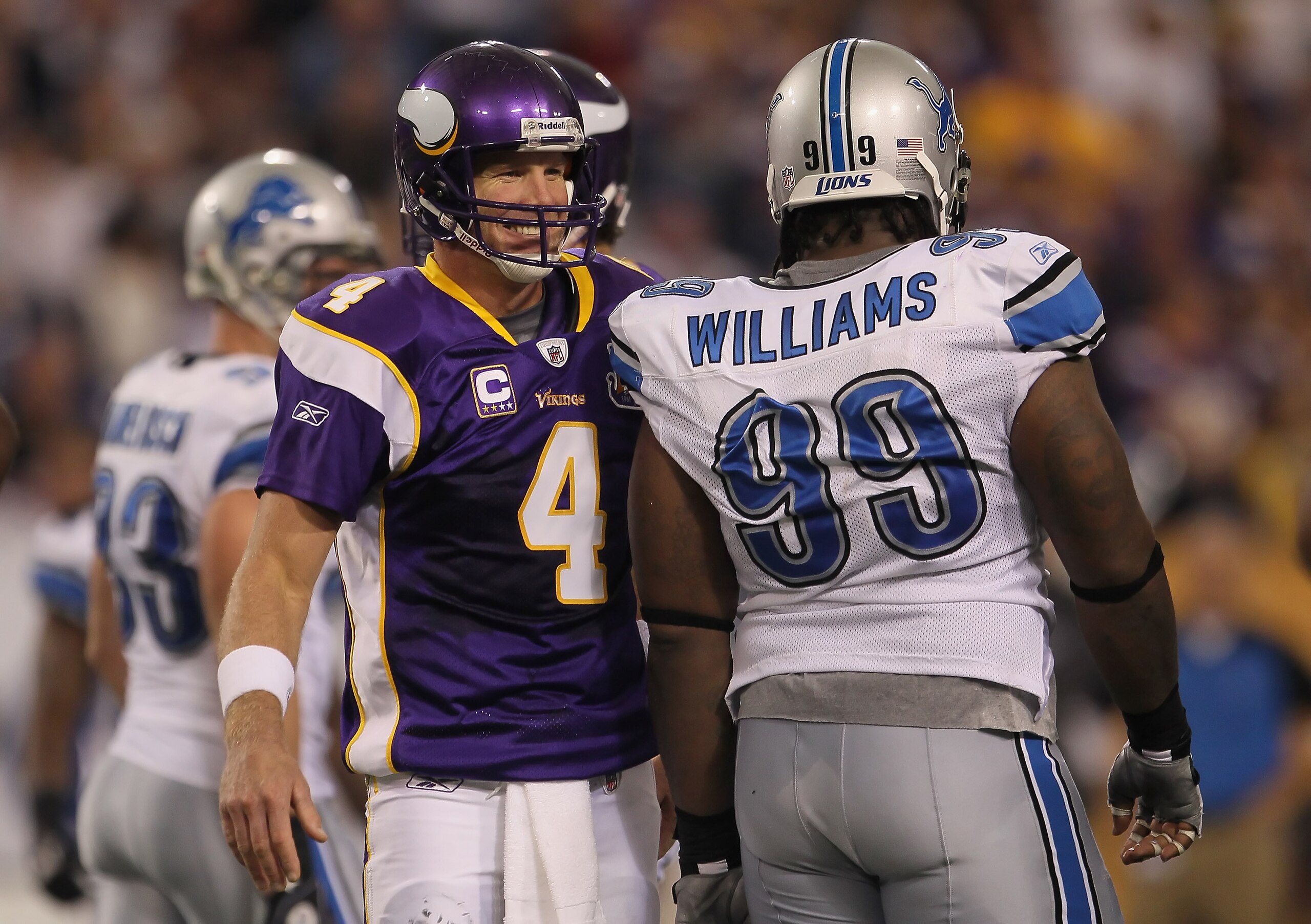 MINNEAPOLIS - SEPTEMBER 26:  Brett Favre #4 of the Minnesota Vikings and Corey Williams # 99 of the Detroit Lions share a laugh during the second half at Hubert H. Humphrey Metrodome on September 26, 2010 in Minneapolis, Minnesota. The Vikings defeated th