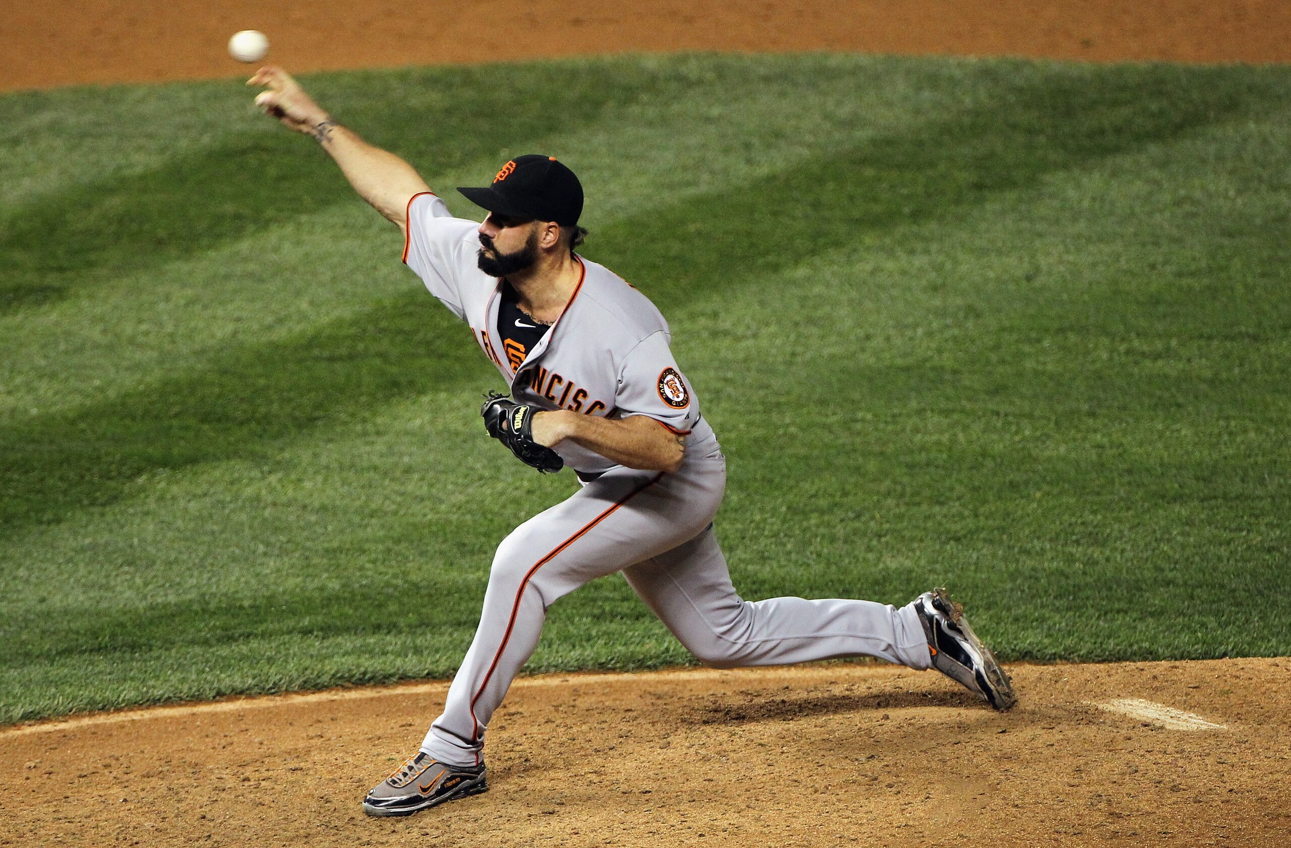 DENVER - SEPTEMBER 25:  Relief pitcher Brian Wilson #38 of the San Francisco Giants delivers against the Colorado Rockies at Coors Field on September 25, 2010 in Denver, Colorado. Wilson collected a blown save and the loss as the Rockies defeated the Gian