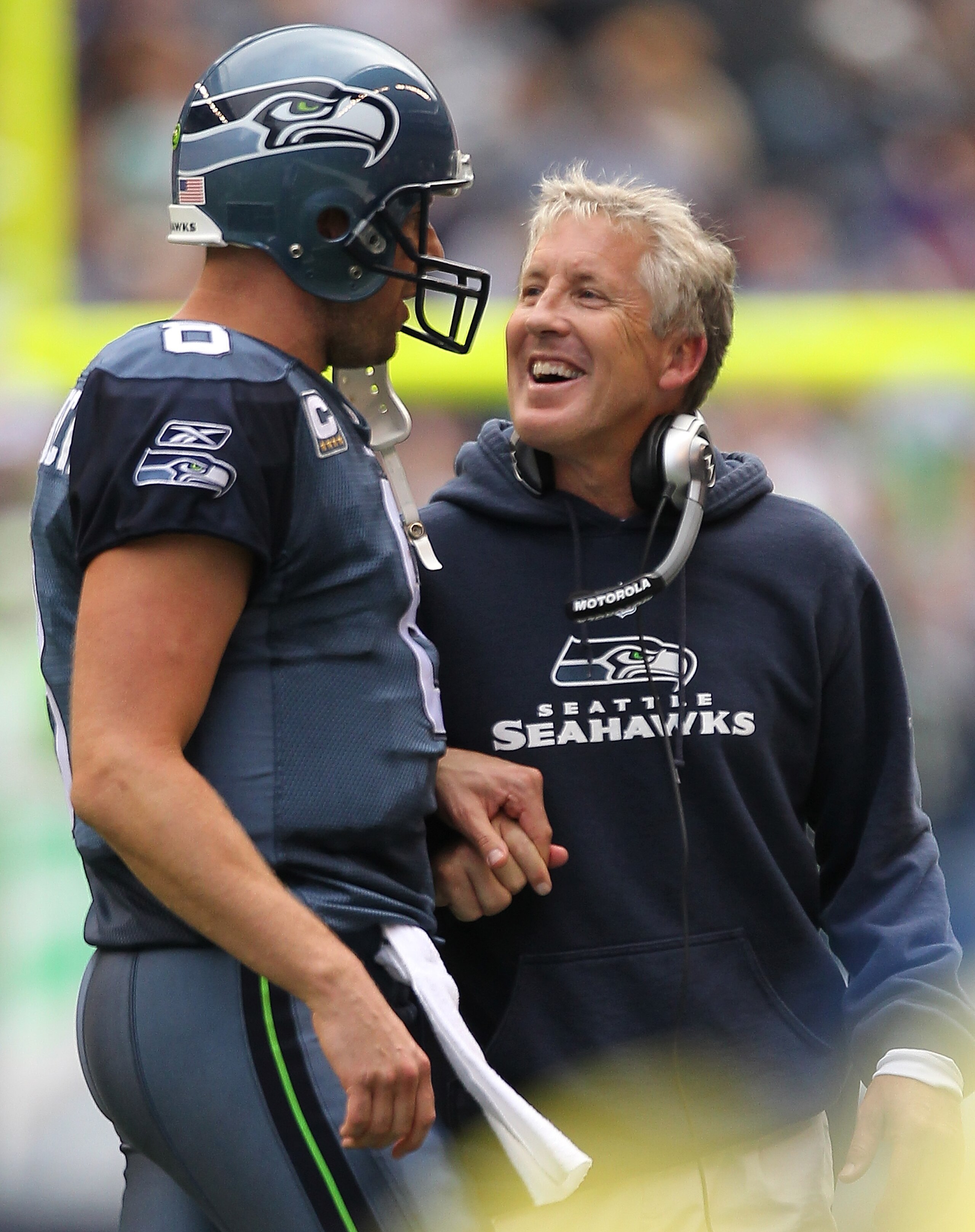 SEATTLE - SEPTEMBER 26: Head coach Pete Carroll of the Seattle Seahawks smiles as he talks to quarterback Matt Hasselbeck #8 after a touchdown against the San Diego Chargers at Qwest Field on September 26, 2010 in Seattle, Washington. The Seahawks defeat SEATTLE - SEPTEMBER 26: Head coach Pete Carroll of the Seattle Seahawks smiles as he talks to quarterback Matt Hasselbeck #8 after a touchdown against the San Diego Chargers at Qwest Field on September 26, 2010 in Seattle, Washington. The Seahawks defeat