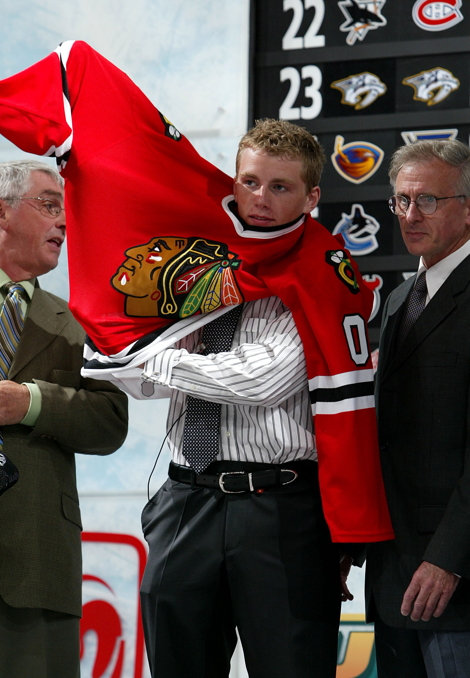 COLUMBUS, OH - JUNE 22:  First overall pick Patrick Kane of the Chicago Blackhawks puts on his new jersey during the first round of the 2007 NHL Entry Draft at Nationwide Arena on June 22, 2007 in Columbus, Ohio.  (Photo by Dave Sandford/Getty Images)
